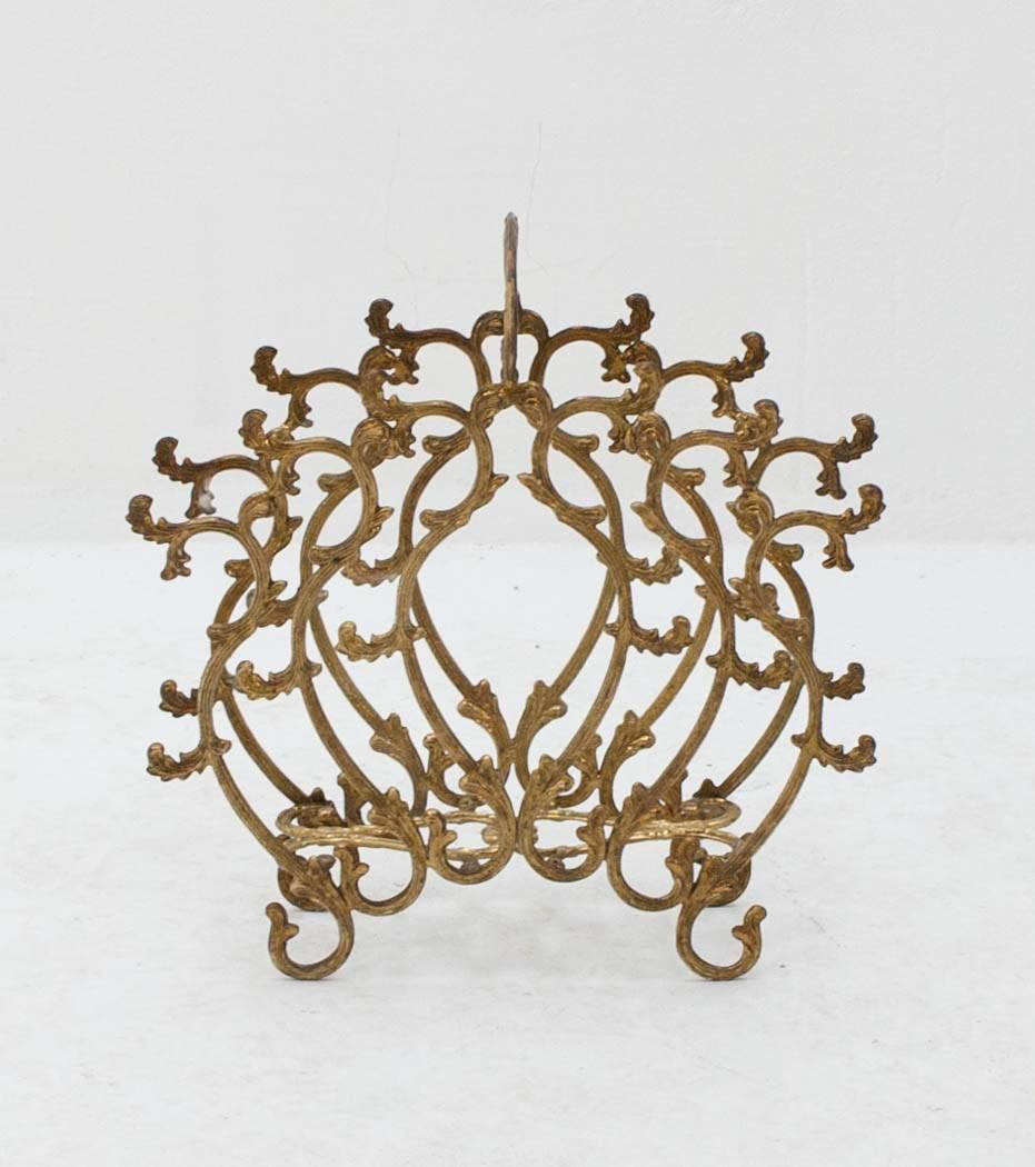 Luxurious Rococo style magazine rack in gilded copper. Nice solid quality piece with just the right amount of patina.