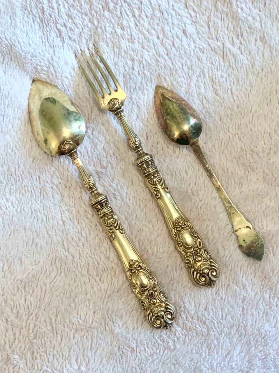 Set worked of gilded Cutlery for entremets. A soup spoon, a fork and a coffee spoon. Very nice set. Shells are visible on the handle of the fork and the spoon making a direct reference to the Louis XIV style. A style used during the Napoleon III
