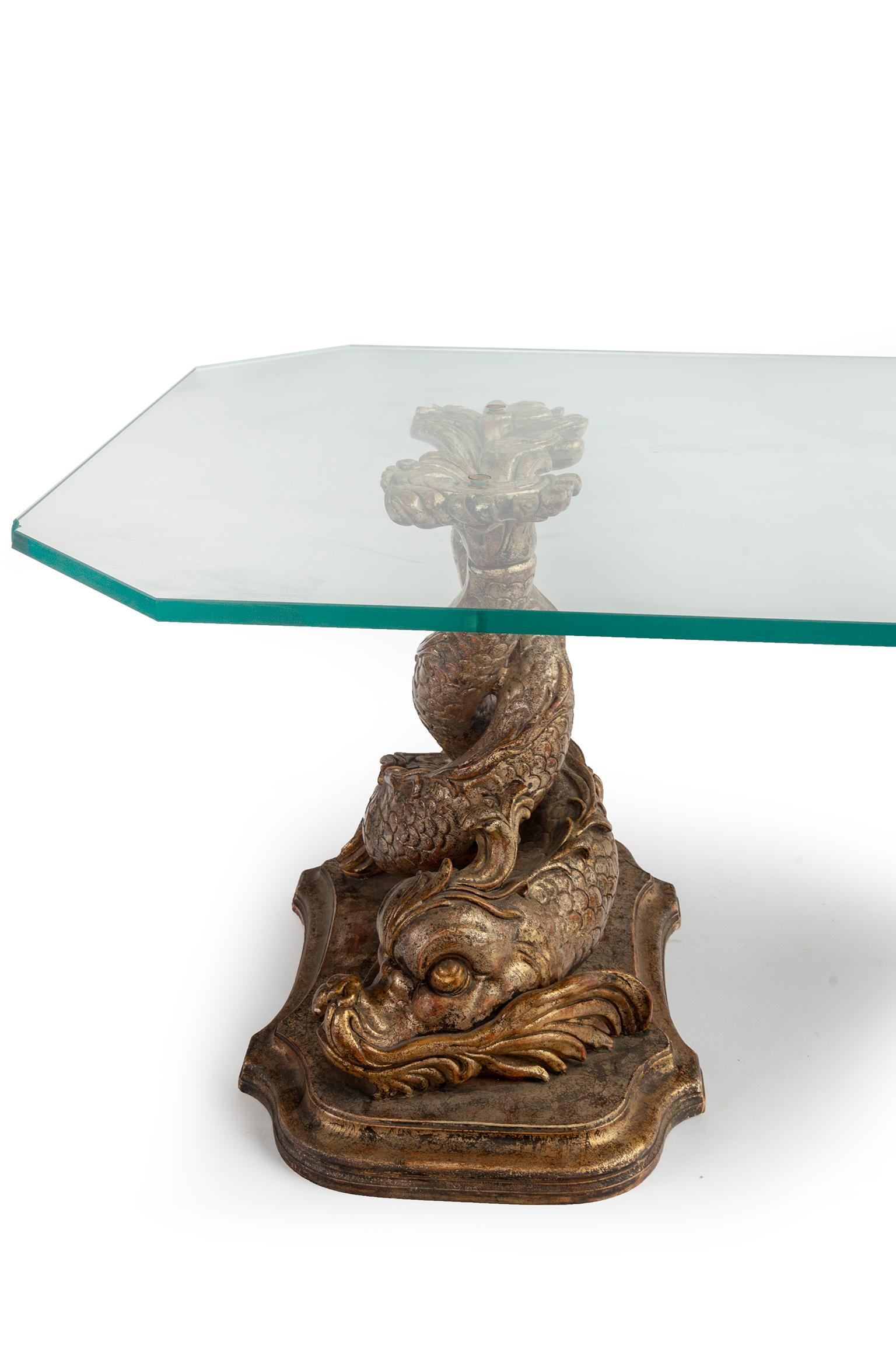 glass coffee table.with dolphin base