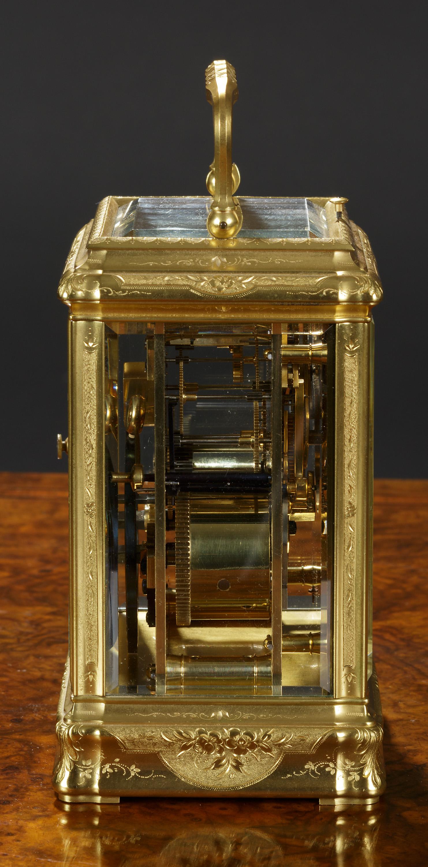 French gilded brass carriage clock in a beautifully engraved gorge case with foliate scrolls and swags with ornate carrying handle. Bevelled glass to all panels with large viewing aperture to the top giving way to a silvered lever platform