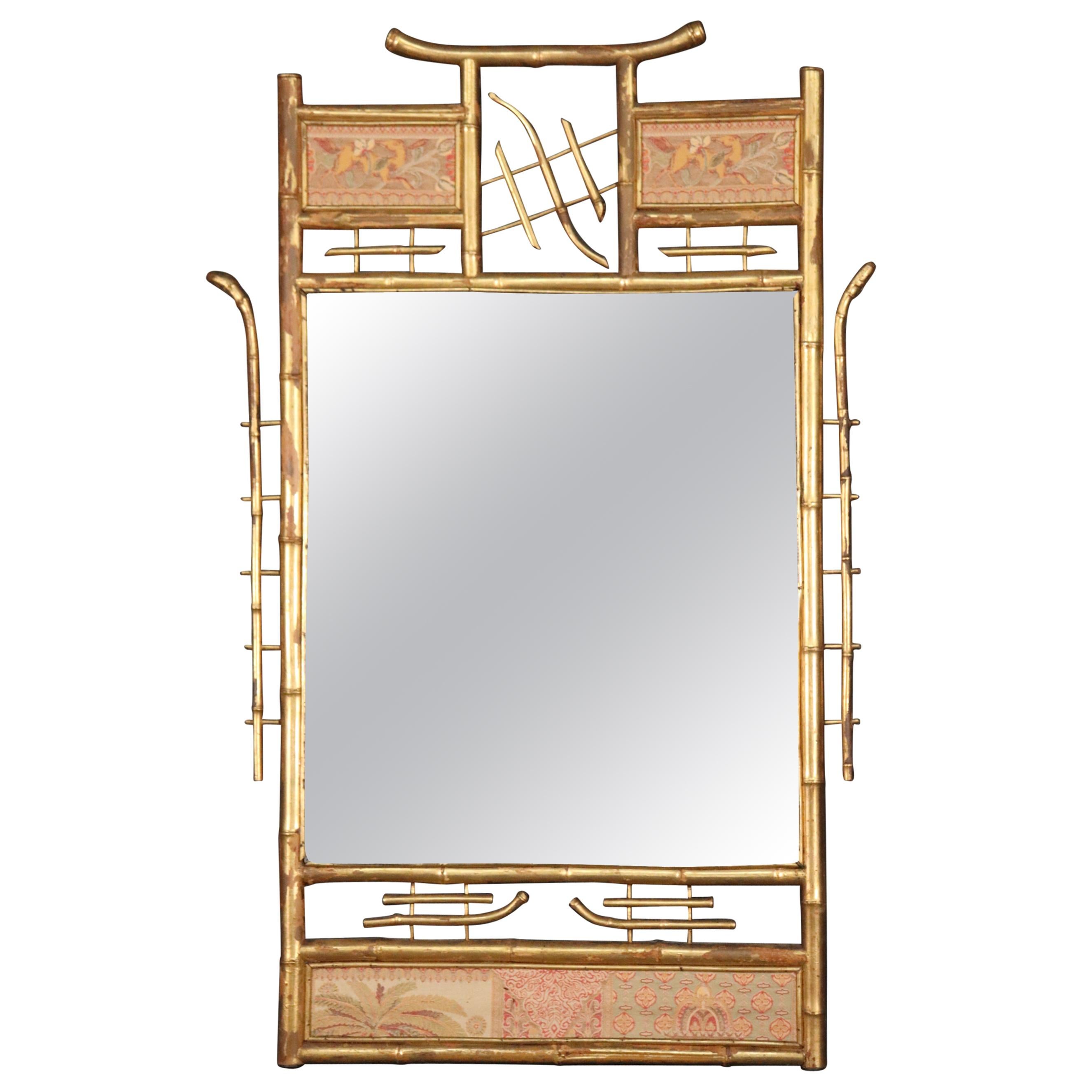 Gilded Faux Bamboo Tapestry Paneled Wall Mirror For Sale