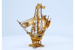 Gilded filigree caravel with enameled crosses on scalloped base