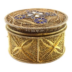 Gilded filigree silver box with enameled flowers and three feet