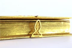 Gilded filigree silver prayer book with central crucifix and enameled frieze