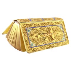 Gilded filigree silver prayer book with central crucifix and enameled frieze Gilded filigree silver prayer book with central crucifix and enameled frieze