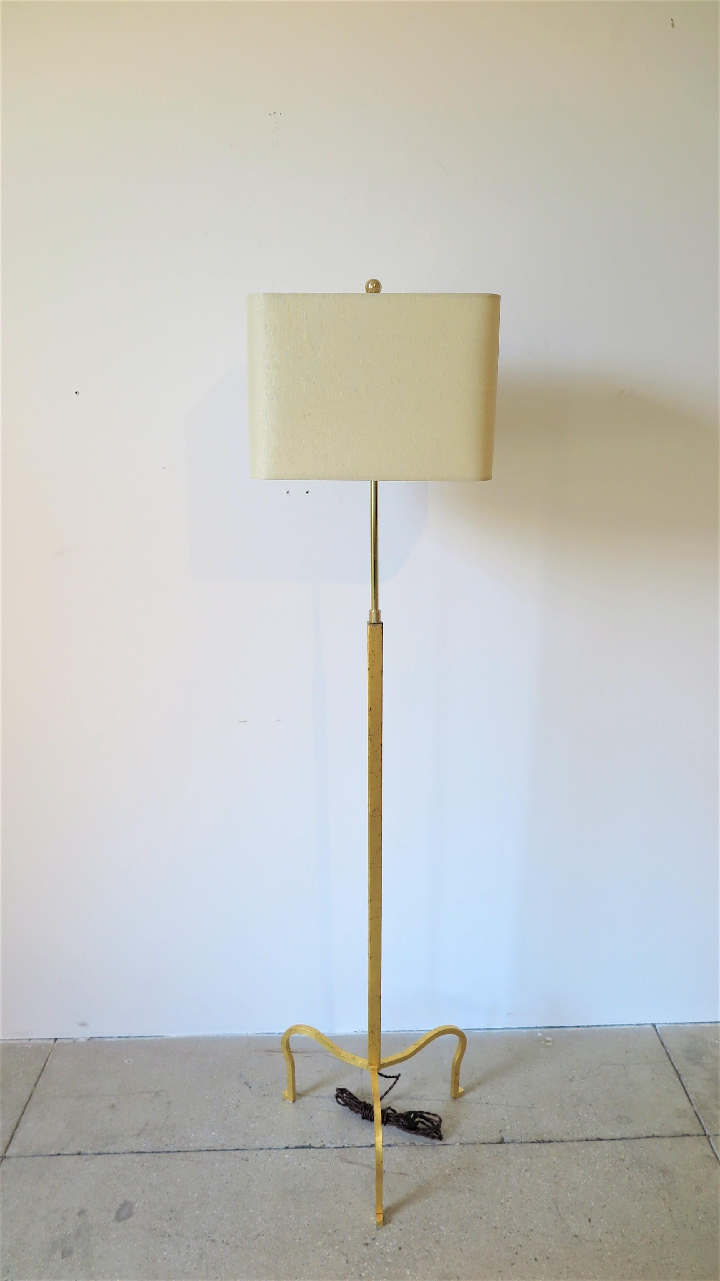 Albert Hadley Gilded Floor Lamp.  Tripod adjustable 24-karat gold leaf gilded floor lamp designed by Albert Hadley and Pairish Hadley Design. Pair available. These uncompleted Lamps where recovered from the closing of the metal fabricators. The
