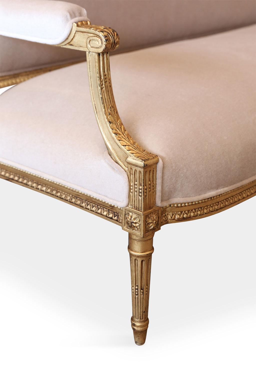 Gilded French settee, hand-carved late 19th century. Newly-upholstered in Coraggio beige-taupe mohair with back covered in taupe and smoke tiger stripe print mohair.