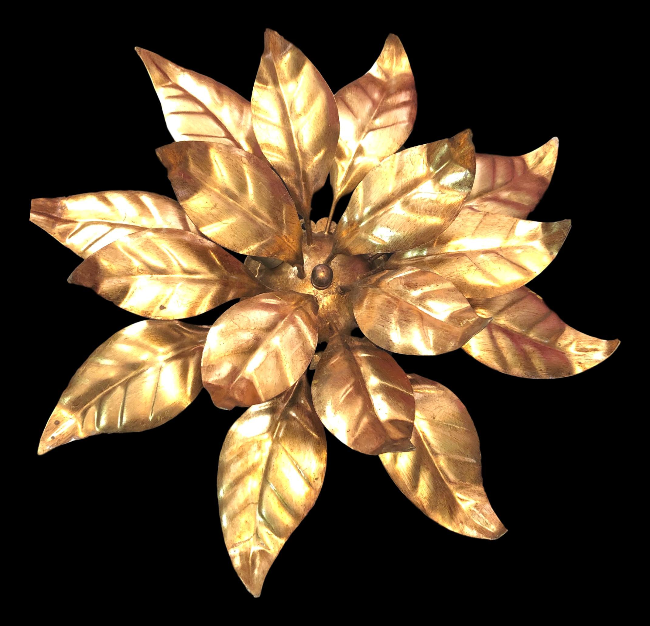 Add a touch of opulence to your home with this charming flush mount. Perfect gilt metal leafs to enhance any chic or eclectic home. We'd love to see it hanging in an entryway as a charming welcome home. Built in the 1960s, attributed to Koegel