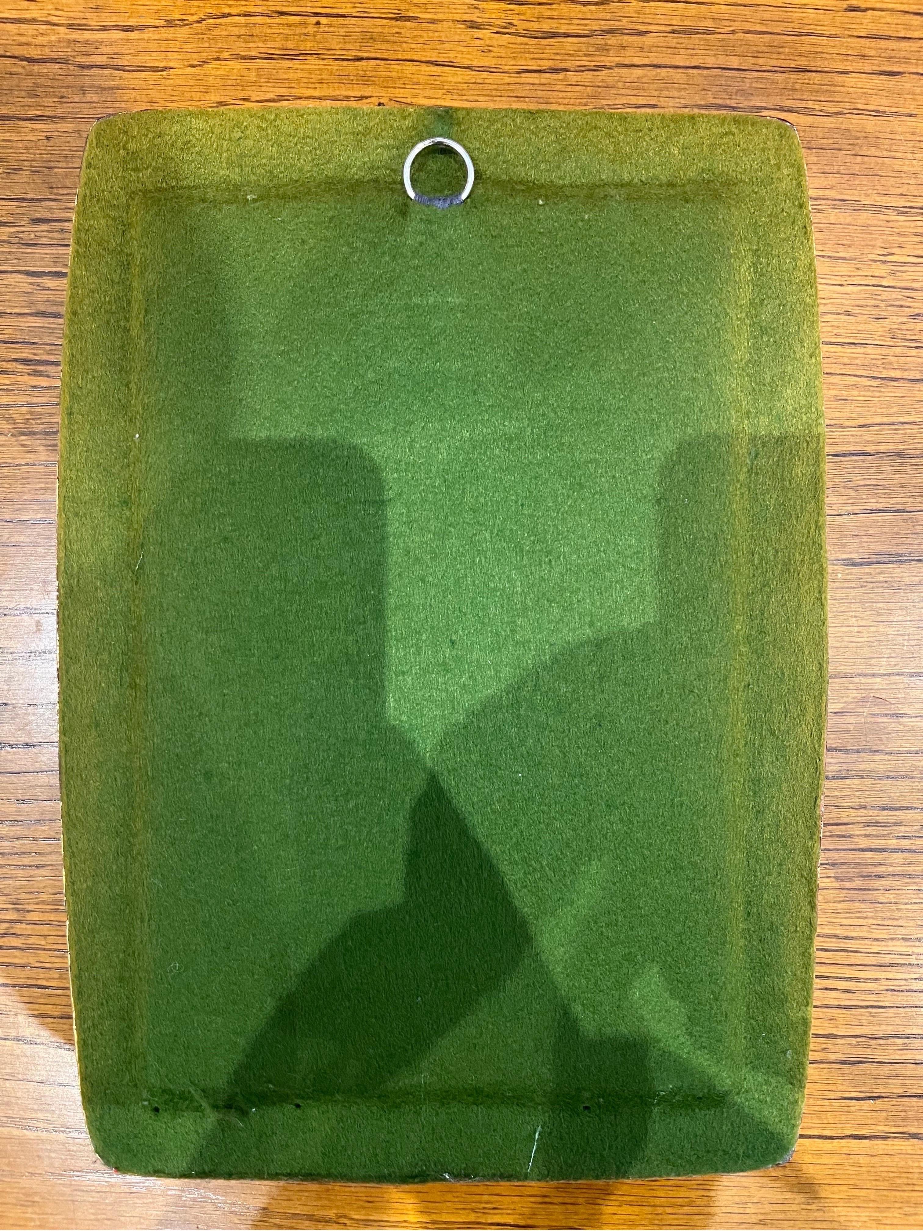 miroir avec feutrine verte au dos