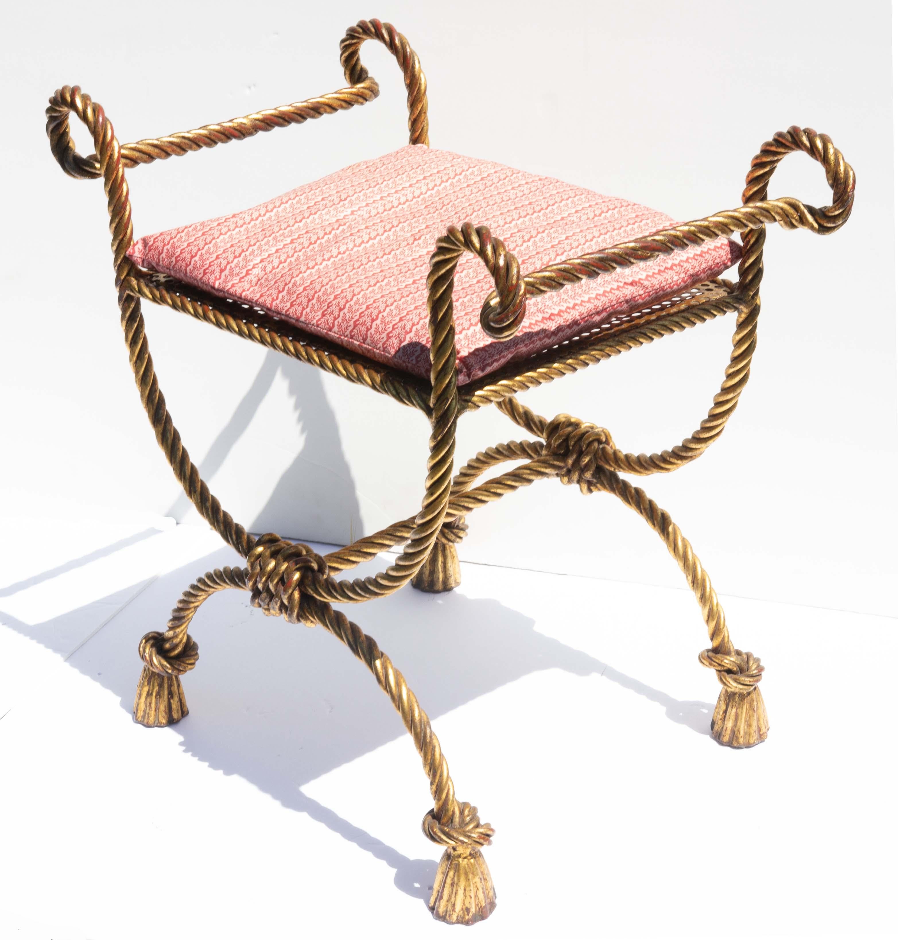 Gilt rope and tassel iron vanity bench attributed to Niccolini. Best quality. Heavy gauge gilded iron. Rich gold gilding. Circa 1960.
 