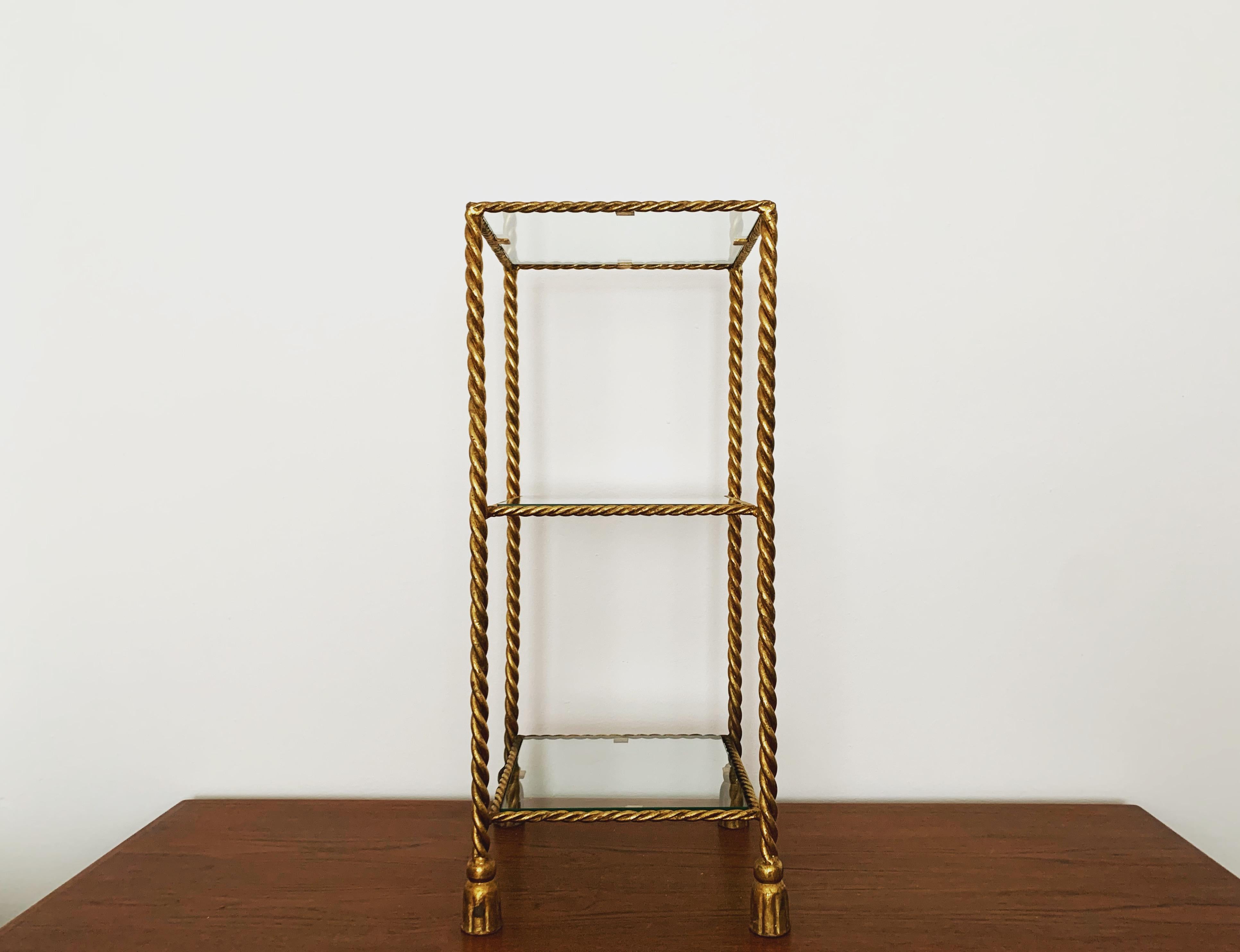 Very nice gilded shelf from the 1970s.
Great design and high-quality workmanship.
Thanks to the design and the high-quality workmanship, the shelf gives every room a touch of luxury.

Condition:

Very good vintage condition with slight signs