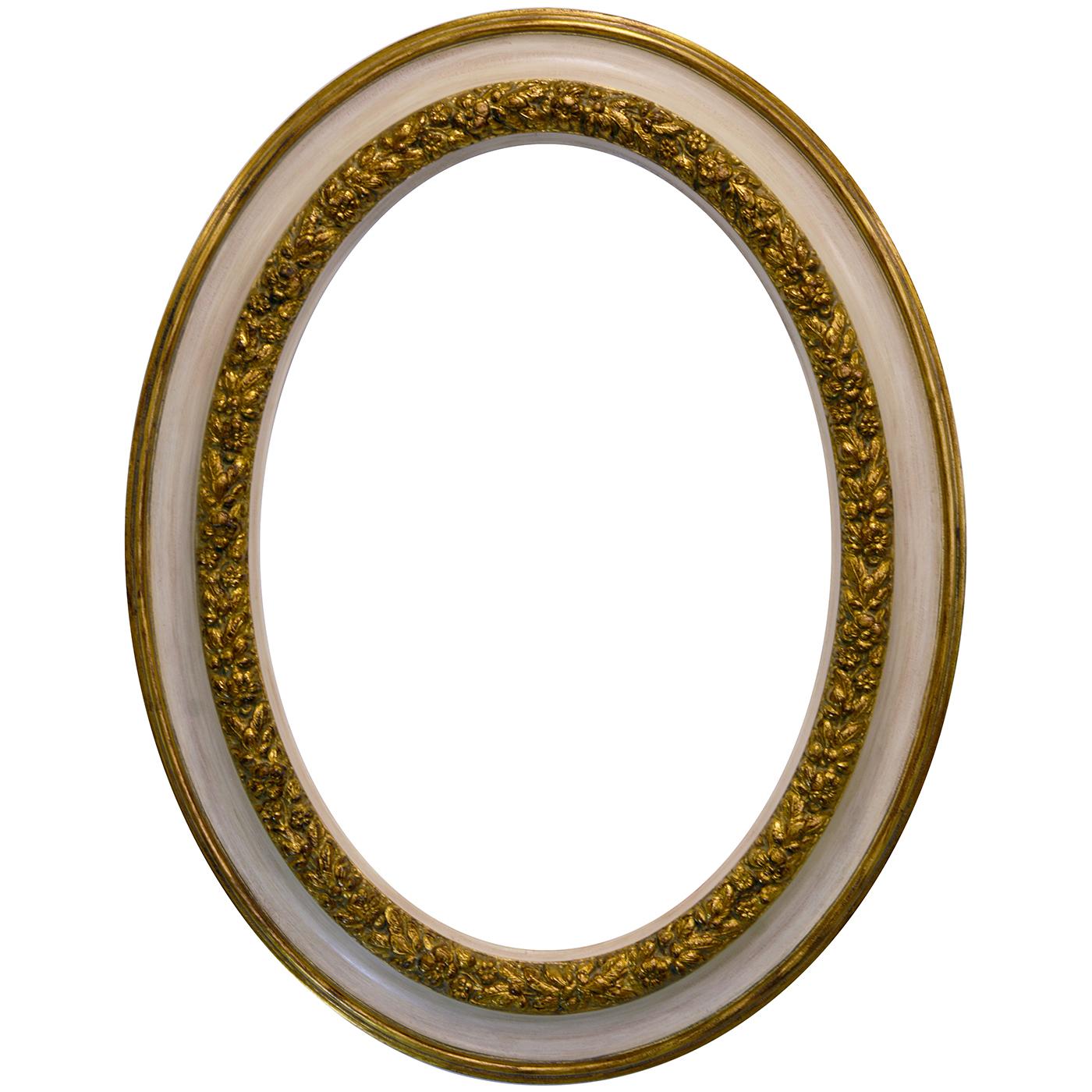 Clean and classic, this gorgeous oval wall mirror is distinguished by a remarkably sophisticated frame handmade of wood decorated with patinated gold leaf and lacquered in ivory white. The internal rim of the frame is exquisitely embellished with