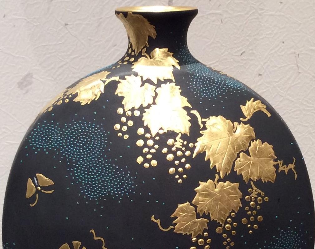 large black and gold vase