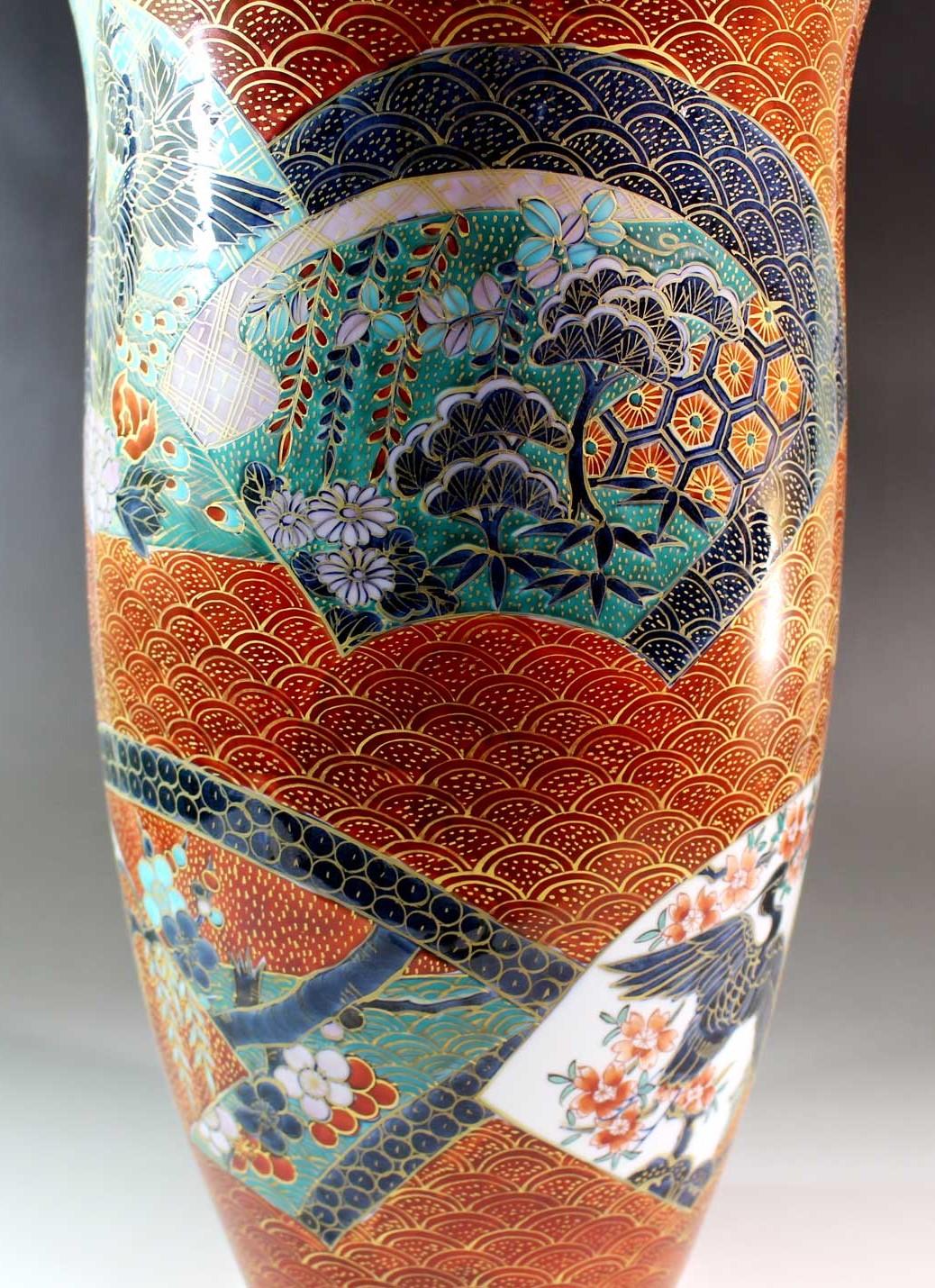 Exceptional large Japanese porcelain vase uniquely gilded in platinum inside, and hand-painted intricately hand painted in red on outside of the strikingly shaped body, a masterpiece by widely respected master porcelain artist of the Imari-Arita