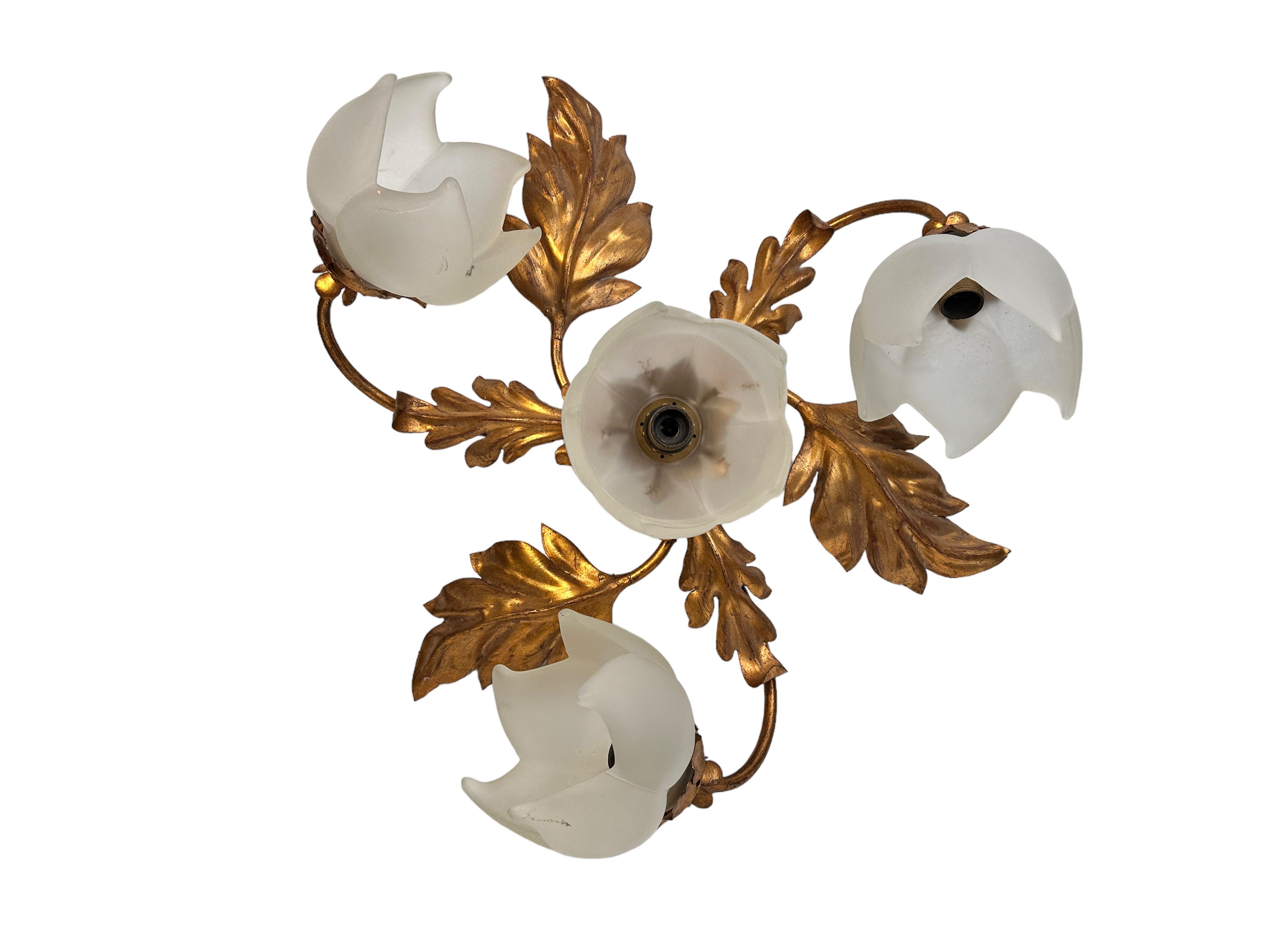 Add a touch of opulence to your home with this charming flushmount. Perfect gilt metal leafs with handmade glass flower style shades to enhance any chic or eclectic home. We'd love to see it hanging in an entryway as a charming welcome home. Built