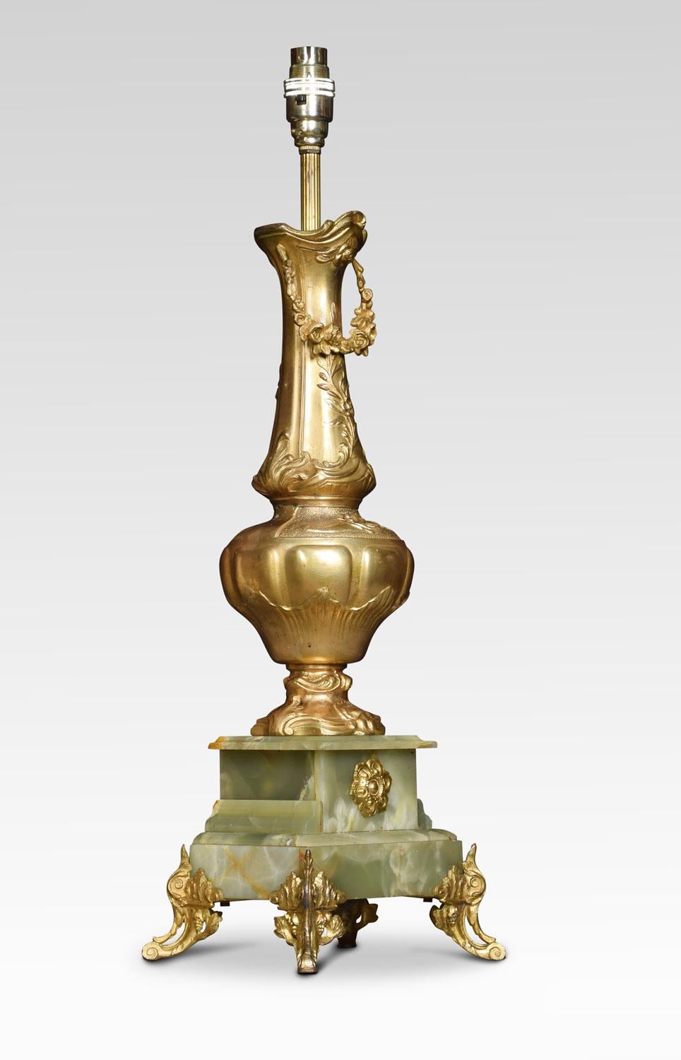 Gilded metal and onyx table lamp of vase form raised up on square plinth terminating in foliating scrolling feet. Together with silk shade.
Dimensions:
Height 23 inches height with shade 35.5 inches
Width 7.5 inches
Depth 6 inches.