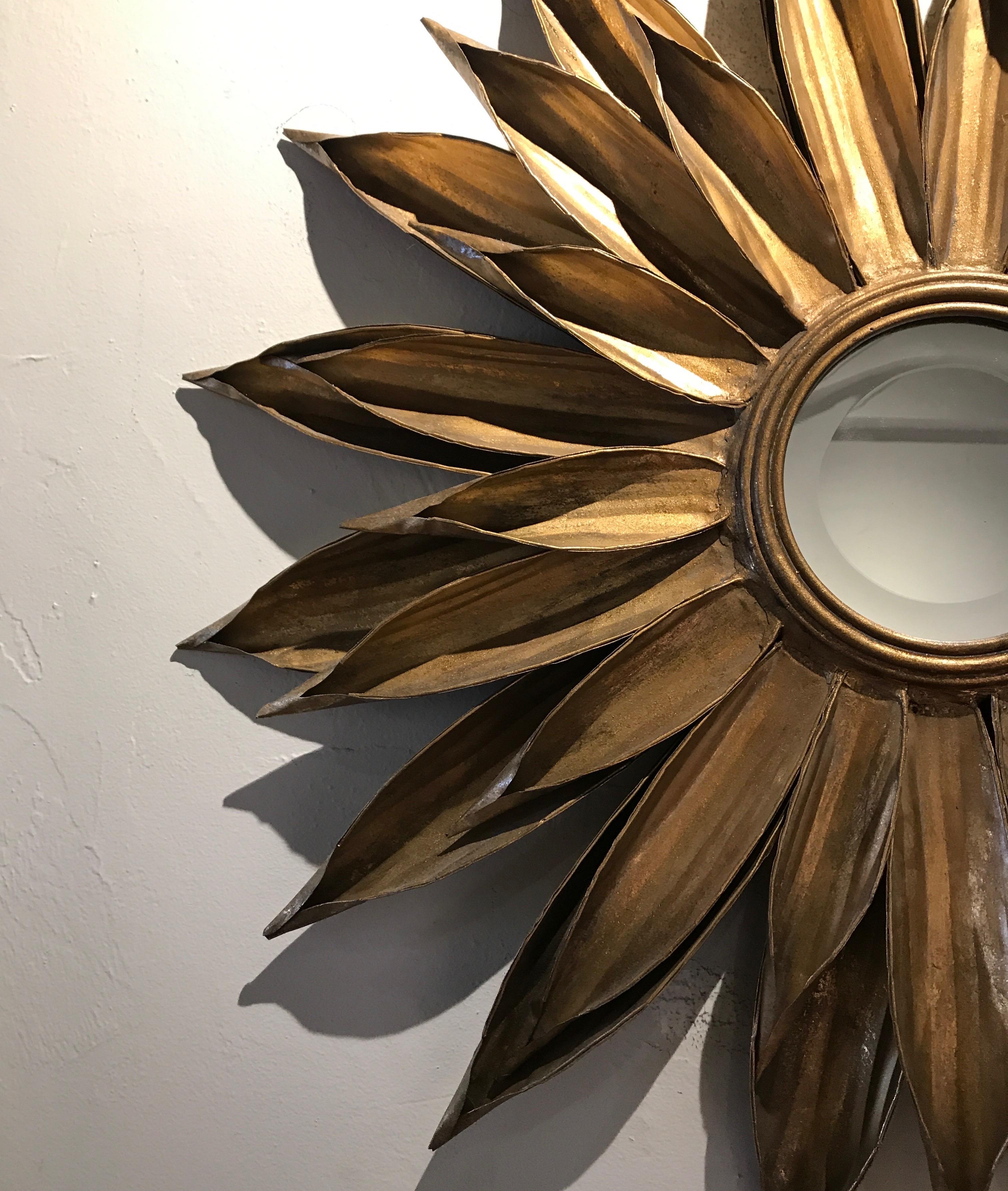 Gold metal sunburst mirror.