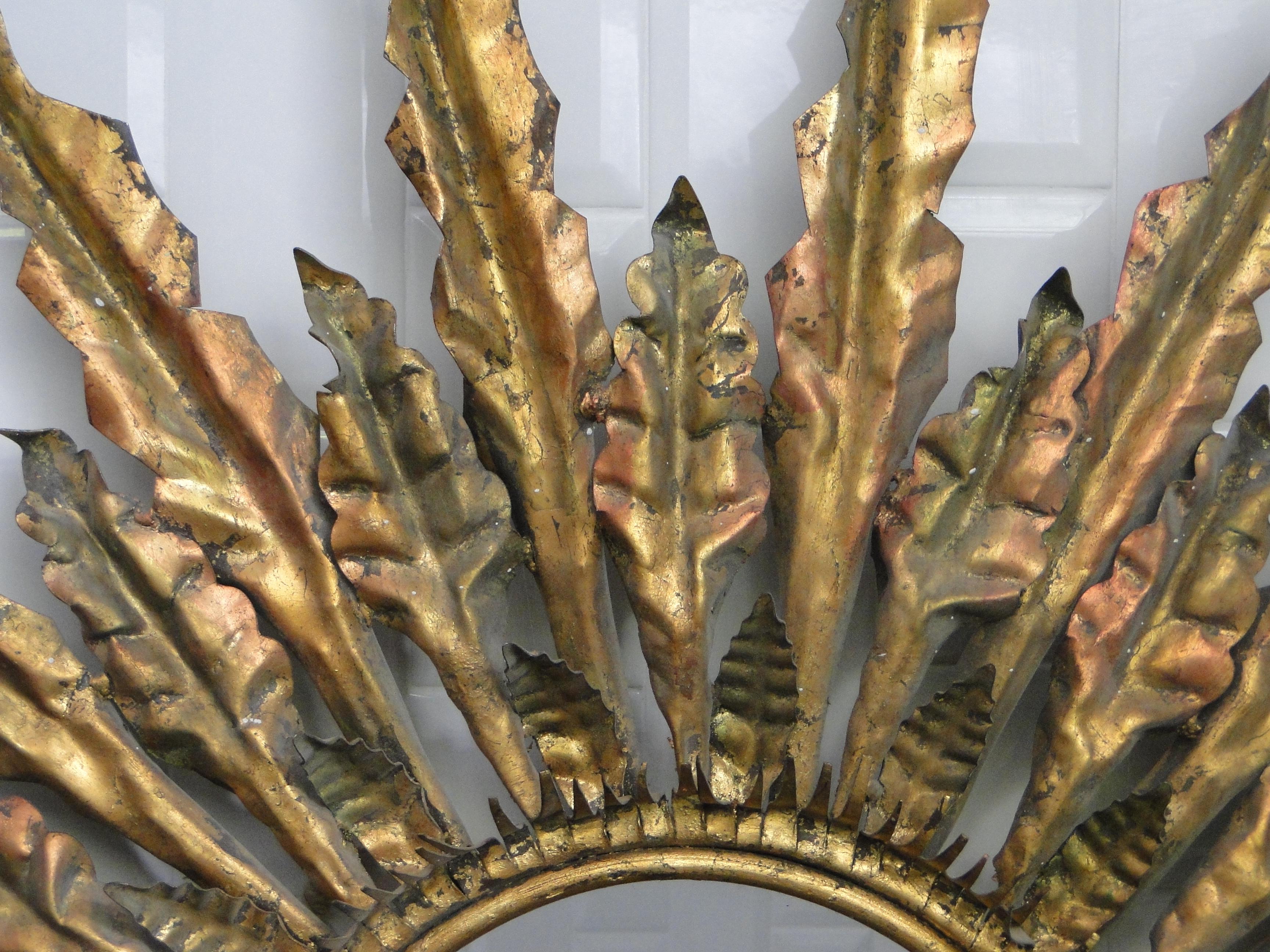 Gilded metal sunburst mirror from the mid-20th century.