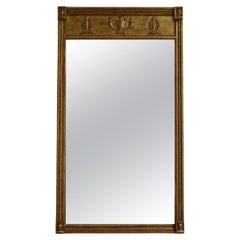 Specchio dorato in stile neoclassico, XIX secolo.