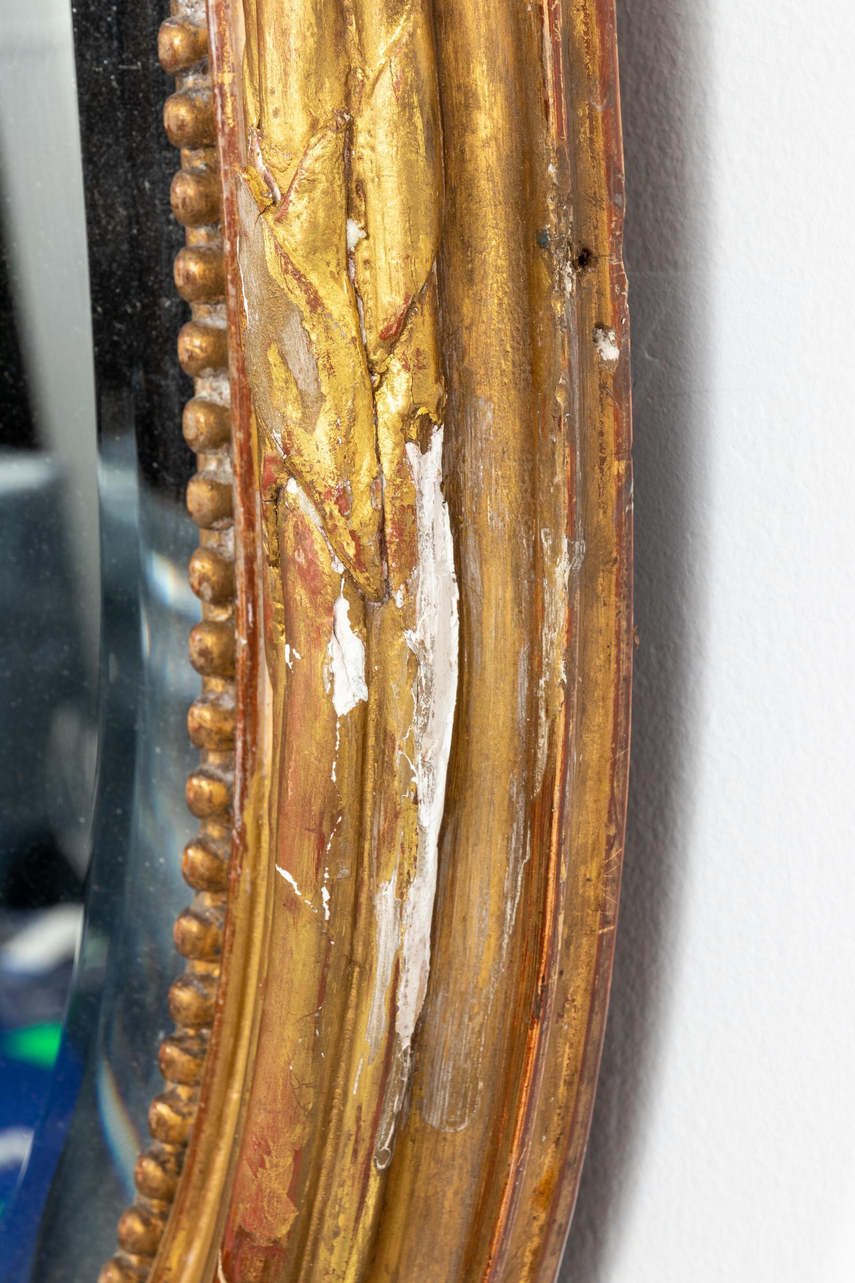 Gilded Oval Mirror with Bow Detail In Good Condition In South Salem, NY