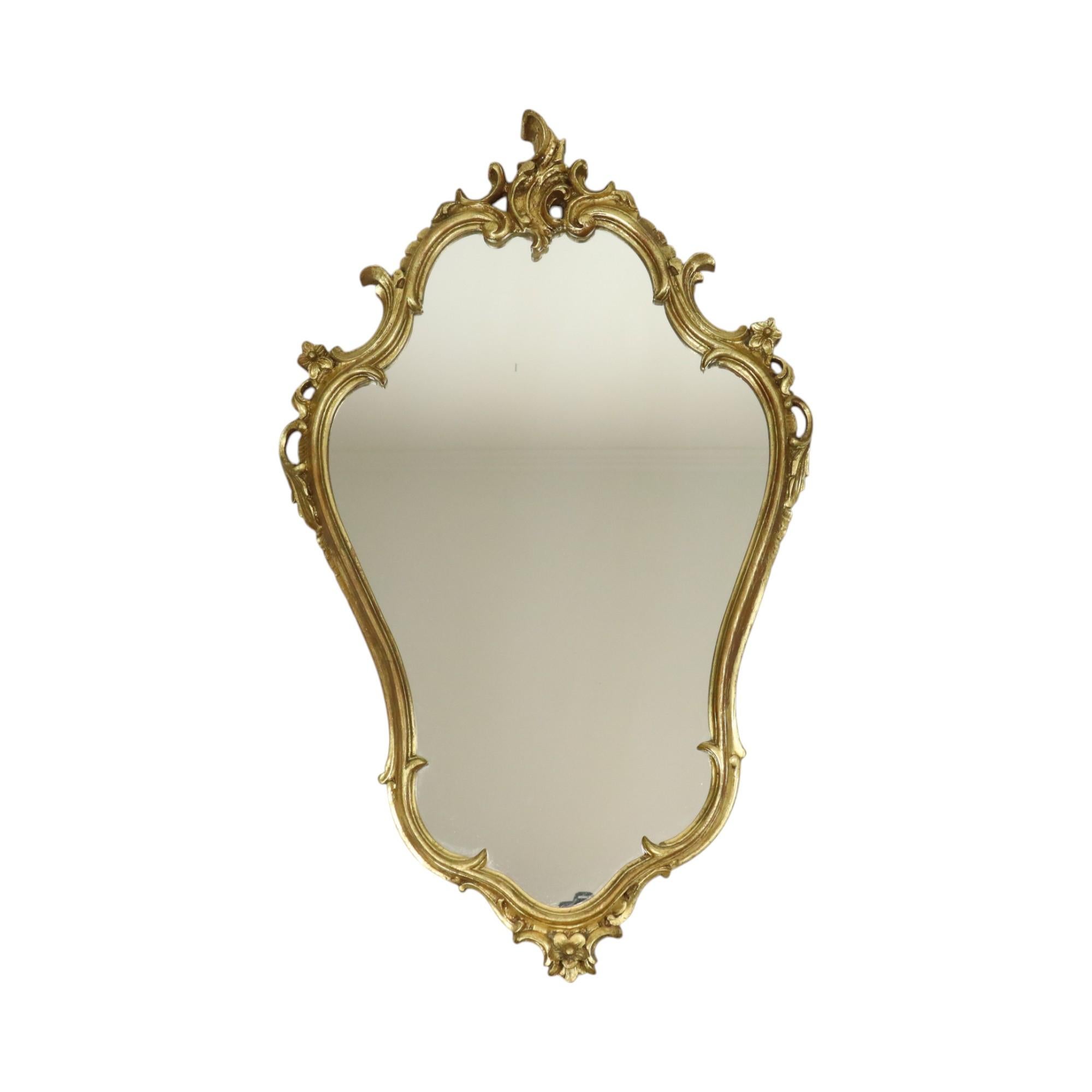 Beautiful gilded mirror with console, entirely in the classic rococo style, approximately mid-20th century, France.

Beautiful ensemble, luxuriously decorated with acanthus leaves and flowers, mirror and console are of high quality and made of