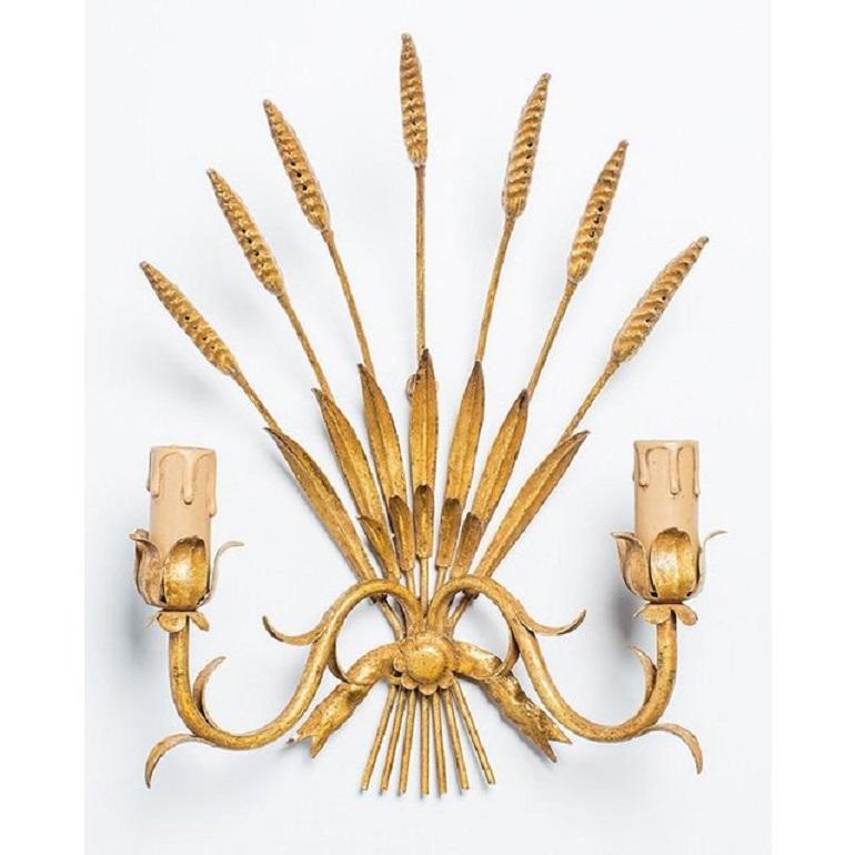 Lovely pair of vintage French Rococo style two-light sconces made in France. Inspired by nature, this light fixture features a classic wheat sheaf motif with decorative botanicals. Rewired for modern use and ready for installation.

