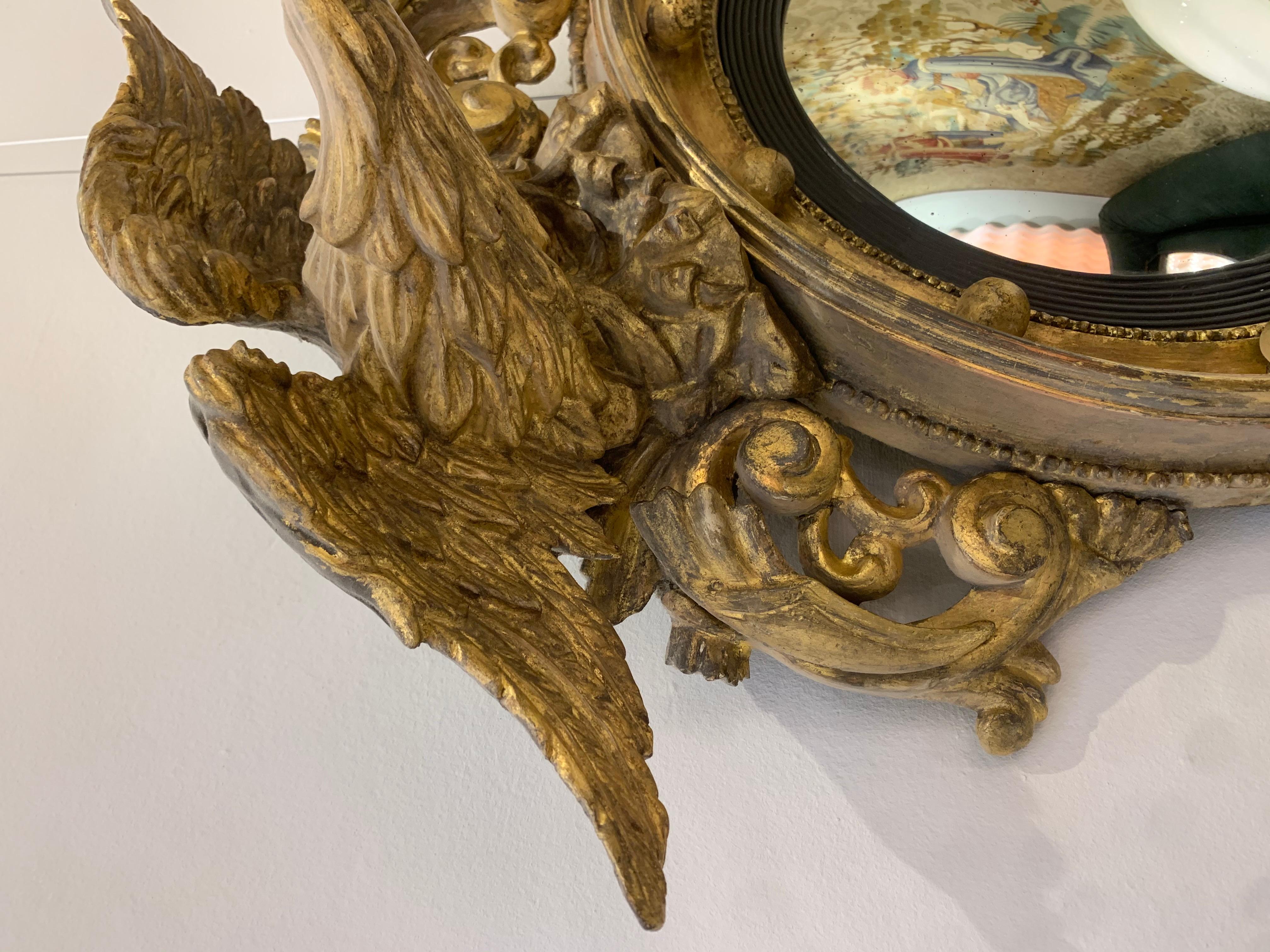 Wood Gilded sculpted wood eagle convex mirror - c.19th century