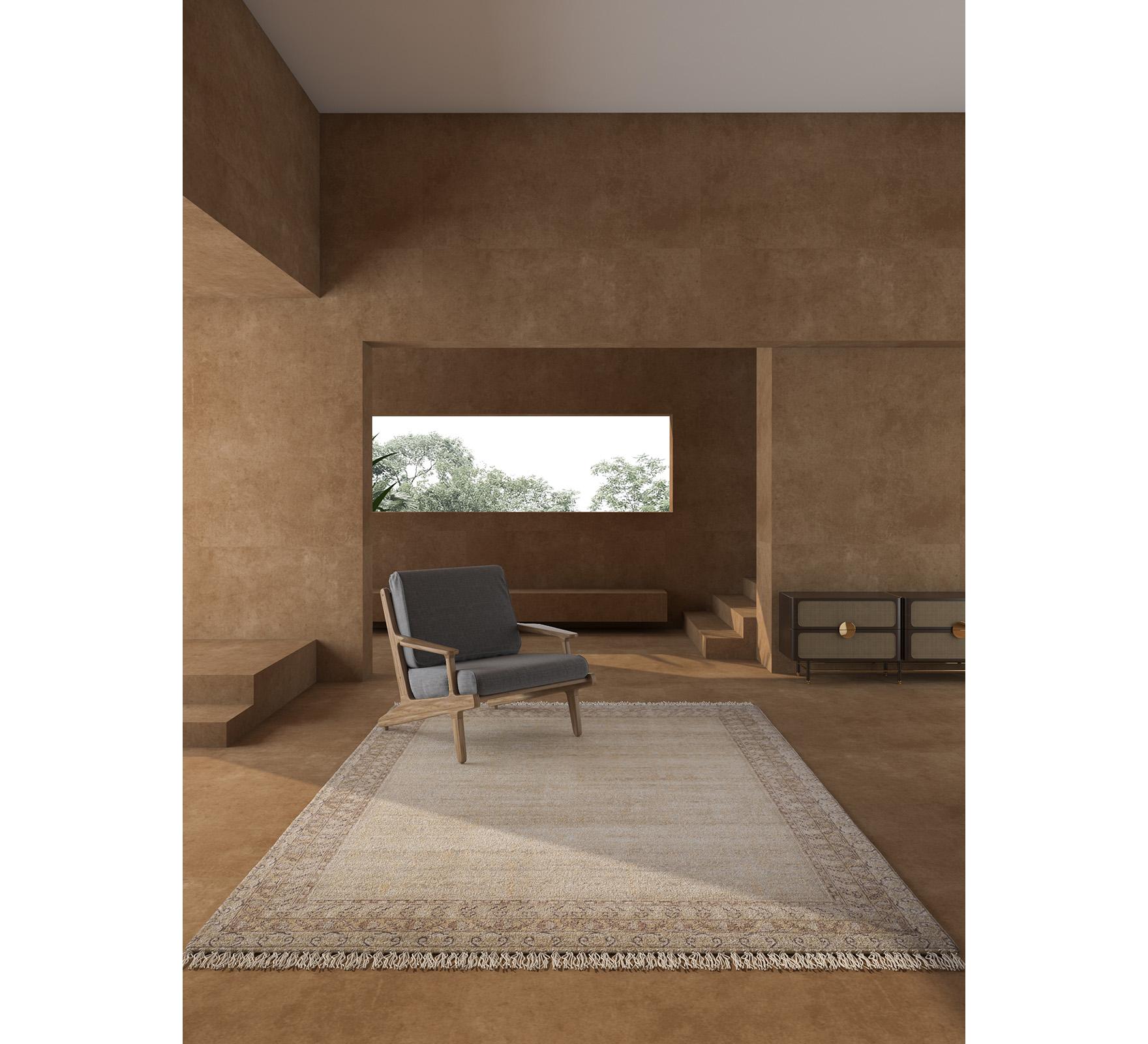 Explore the transformative magic of this hand-knotted rug that transcends conventional decor. Enveloped in a soothing tone-on-tone palette, it becomes an instant mood lifter for any space. Infusing warmth and comfort into your floors, this modern