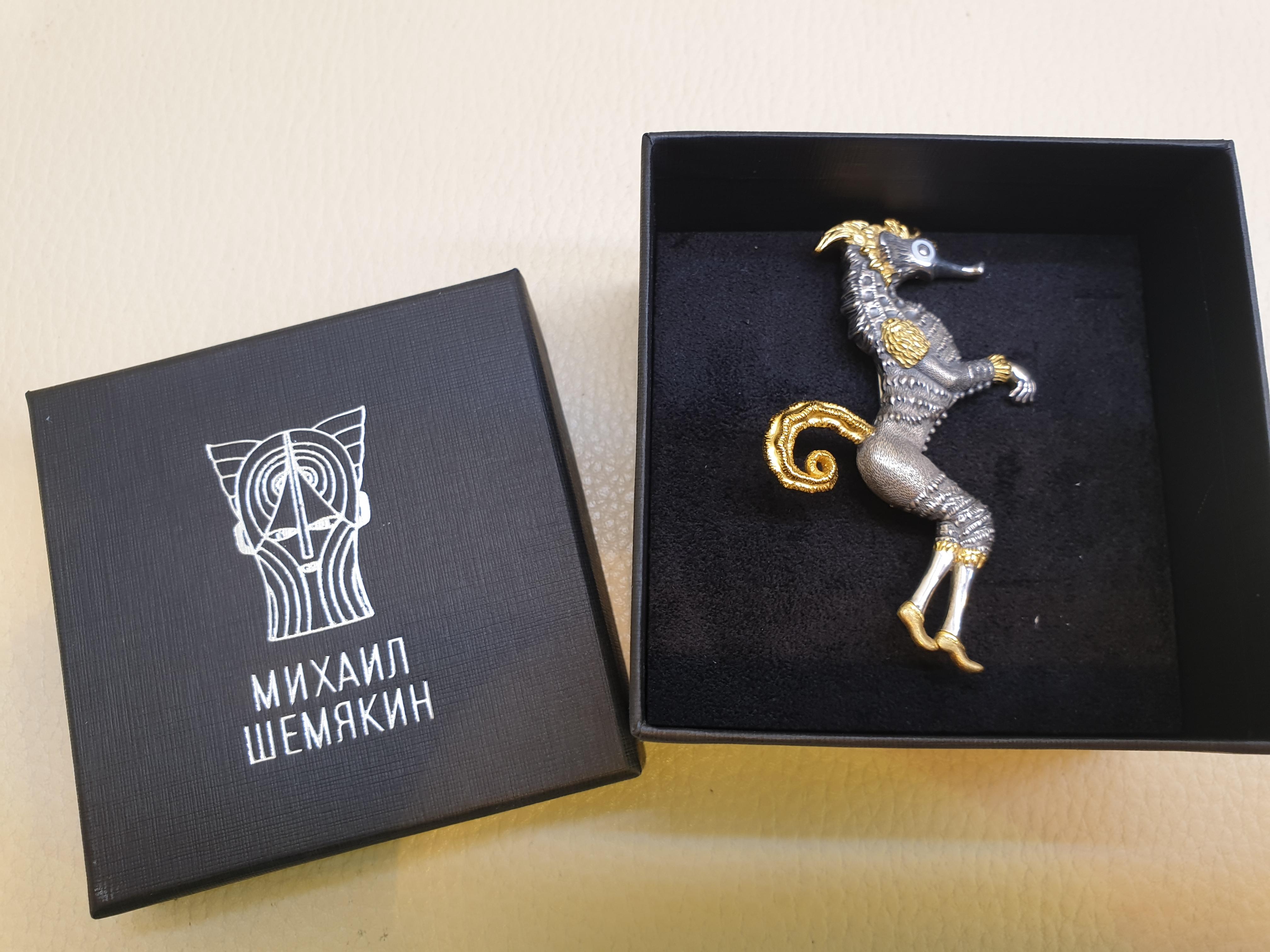 Brooch - Pendant  Aquatic Warrior. Bestiary series.
Gilded silver 22k enamel brooch/pendant with 24k gold plating
Pin 14k white gold 0.5 gr

Inspired by the costume design that Chemiakin undertook for the Mariinsky Theatre’s productions of the