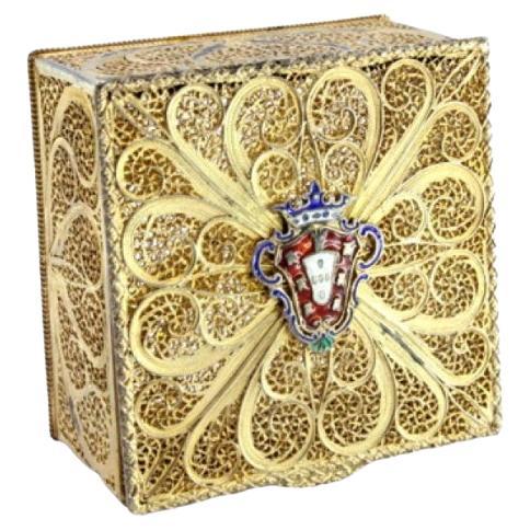 Gilded silver box with filigree reliefs and armorial bearings