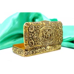 Gilded silver box with floral motifs, children scene and gold interior