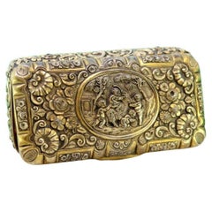 Gilded silver box with floral motifs, children scene and gold interior