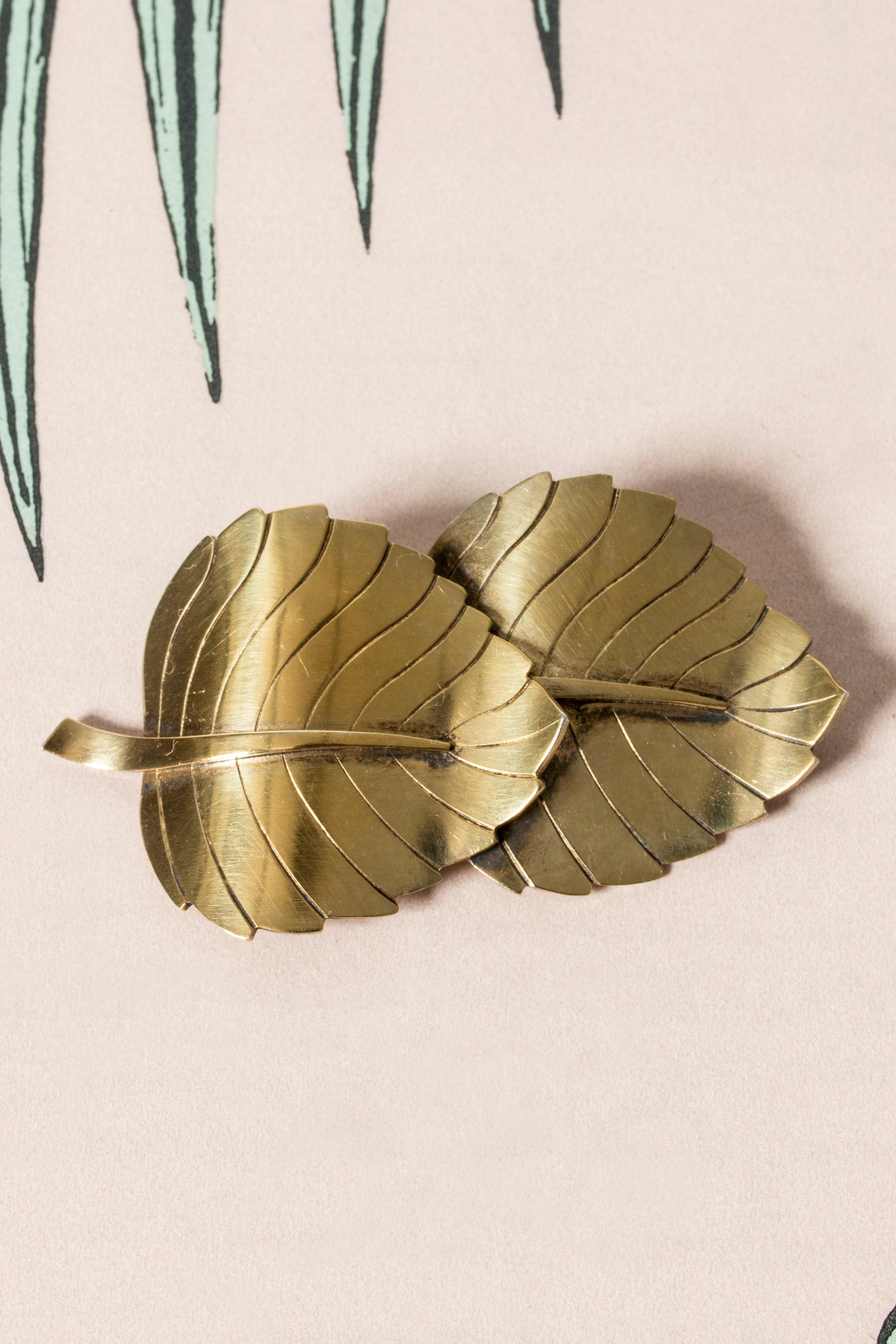 Beautiful gilded silver brooch by Sigurd Persson, in the form of two large leaves. Elegantly made with attention to detail in the veins and billowing form.
