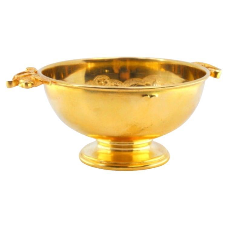 Gilded silver cup with handles cut out with reliefs and engravings on the inside For Sale