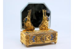 Gilded silver filigree jewelry box shaped like a dresser with mirror