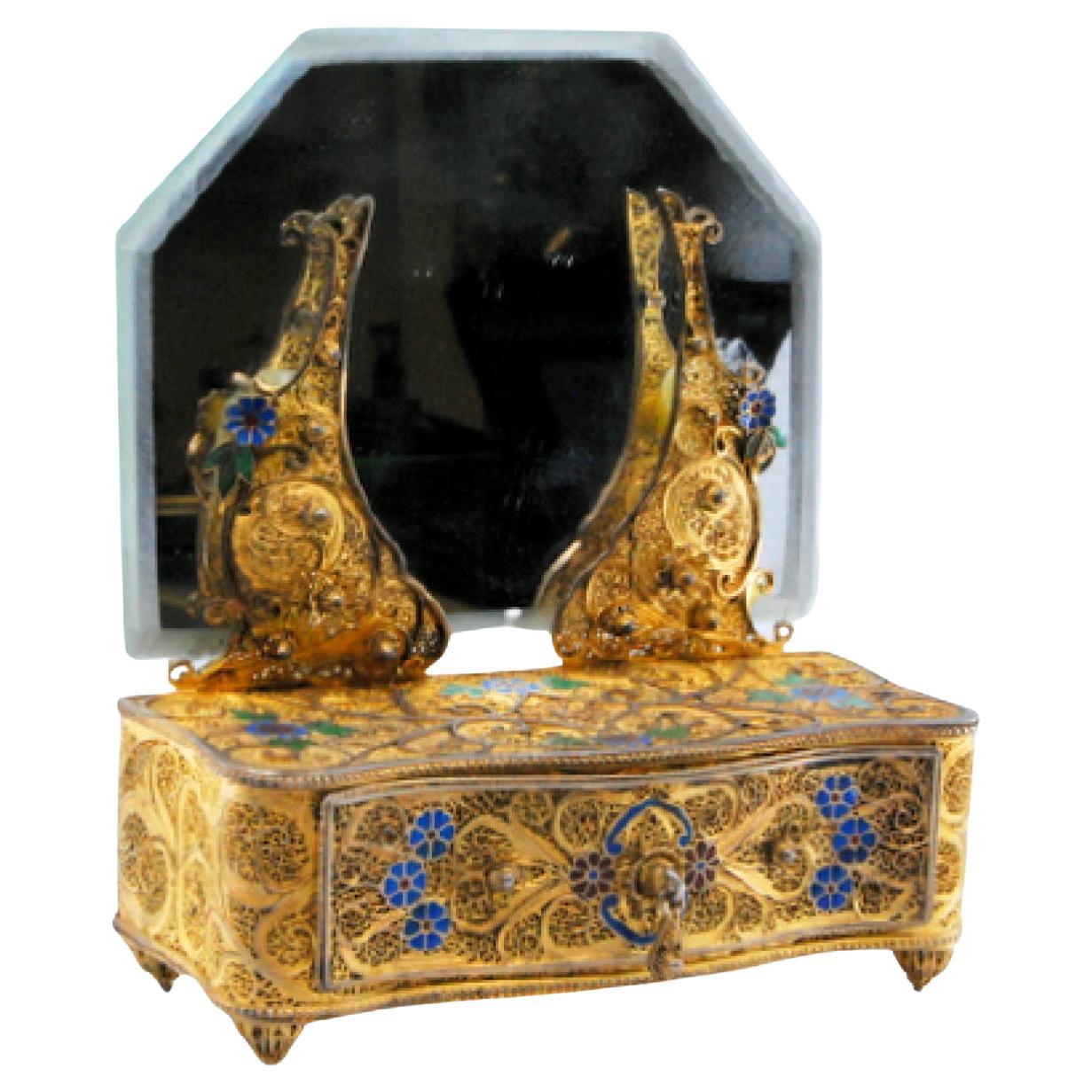 Gilded silver filigree jewelry box shaped like a dresser with mirror