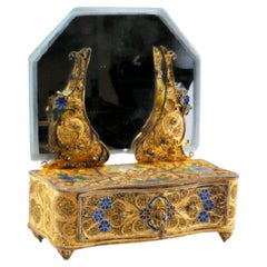 Gilded silver filigree jewelry box shaped like a dresser with mirror