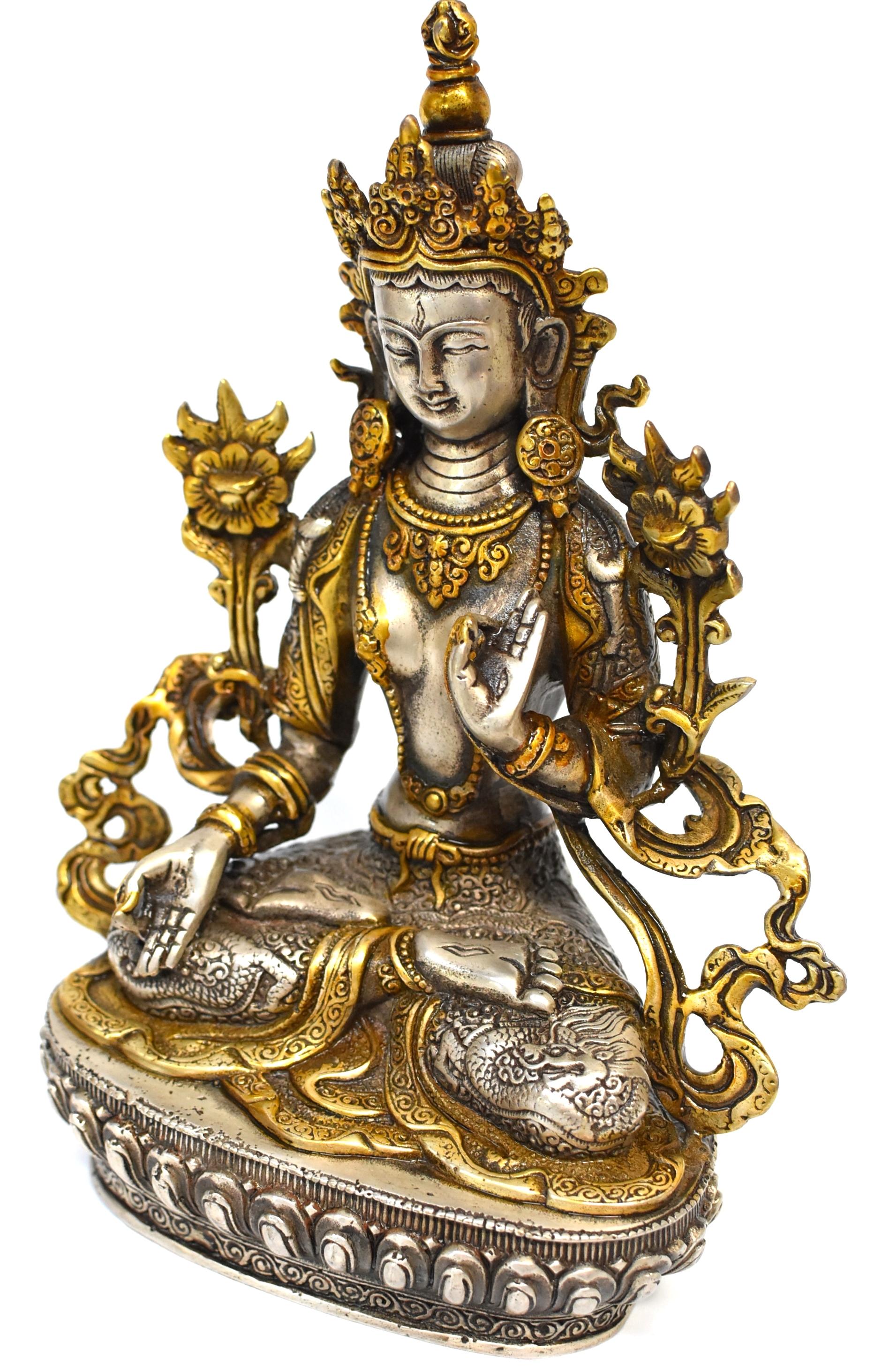 A beautiful statue of Tibetan Bodhisattva White Tara. The Goddess of Great Compassion, she brings blessings and is quick to answer prayers. In this statue she wears a high crown and embossed skirt demonstrating lions and dragons. A fully embossed