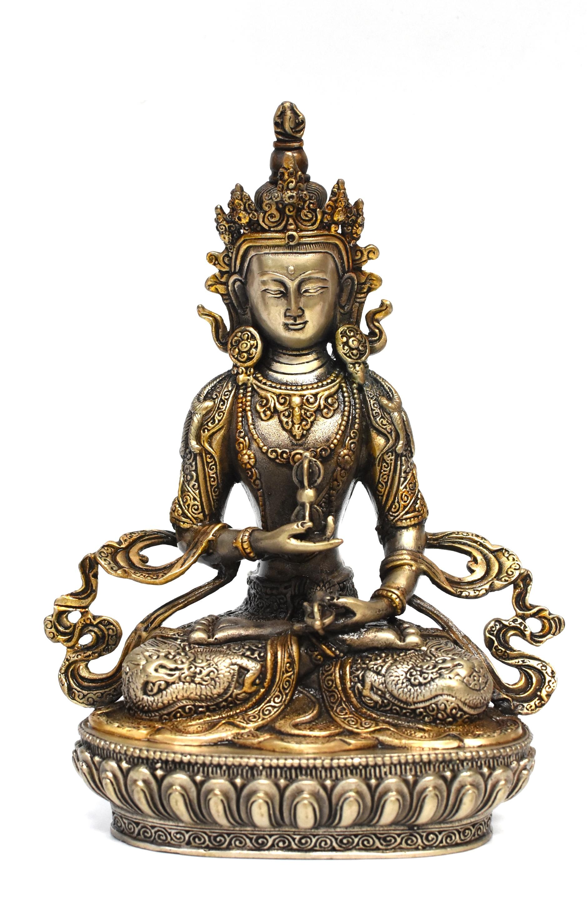 A beautiful statue of Tibetan Bodhisattva Vajrassatva in silver and gold finish. The Vajrassatva is an deity that focuses on purification of bad karma.  Meditation upon Vajrassatva is integral to enlightenment as it manifests in one's compassion for