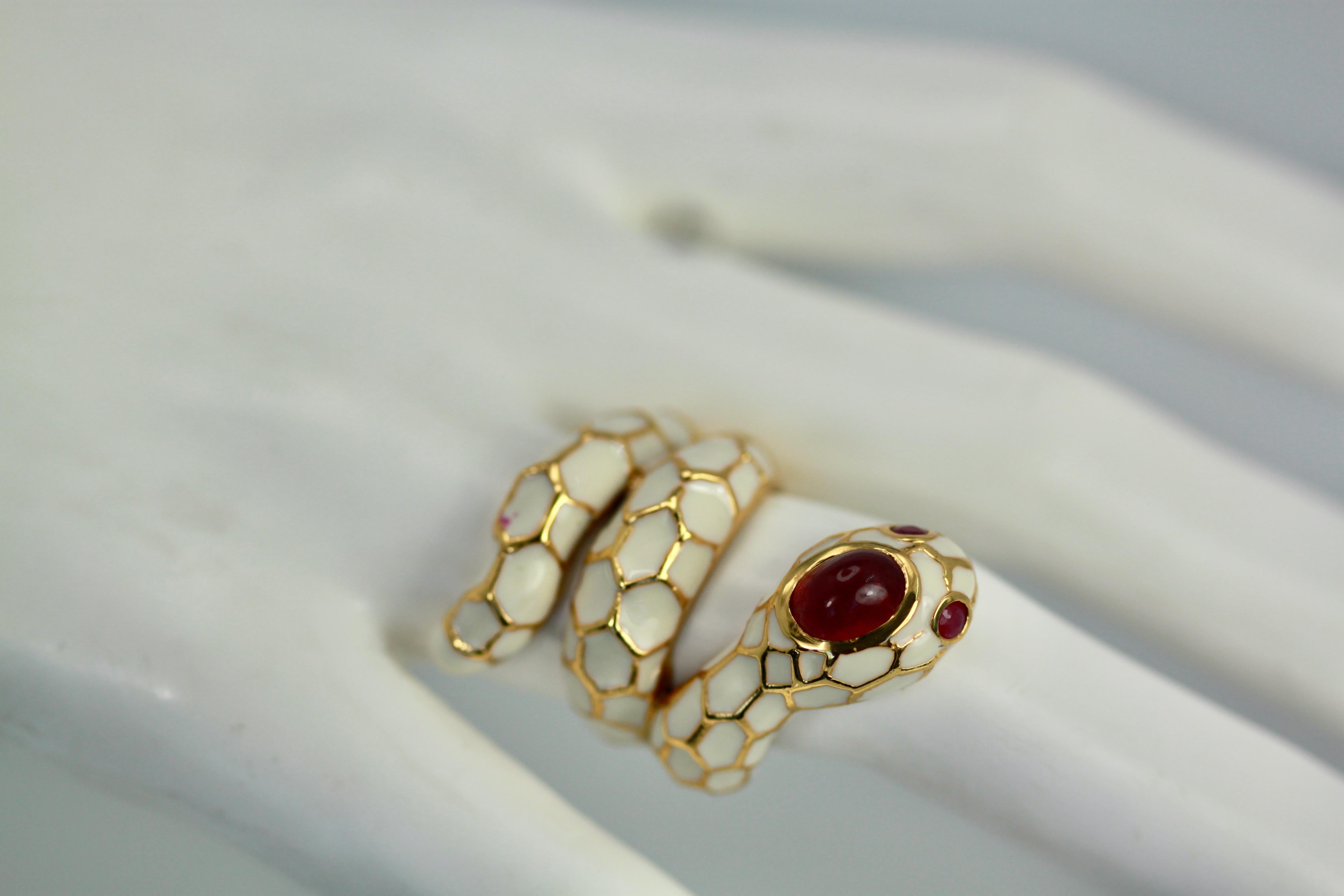 I usually do not purchase anything that is not 14K, 18K, or platinum but this snake ring really caught my eye. This lovely snake ring has a Ruby of 1 carat, two (2) Ruby eyes of 0.10 ct each.  This ring is done in white enamel with a Gold wash. and