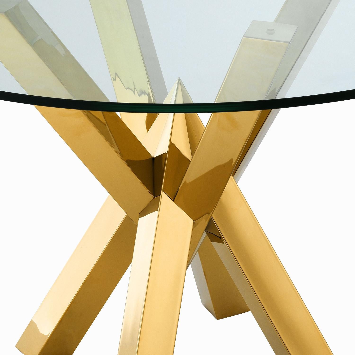 Gilded stainless steel and glass round dining pedestal table.