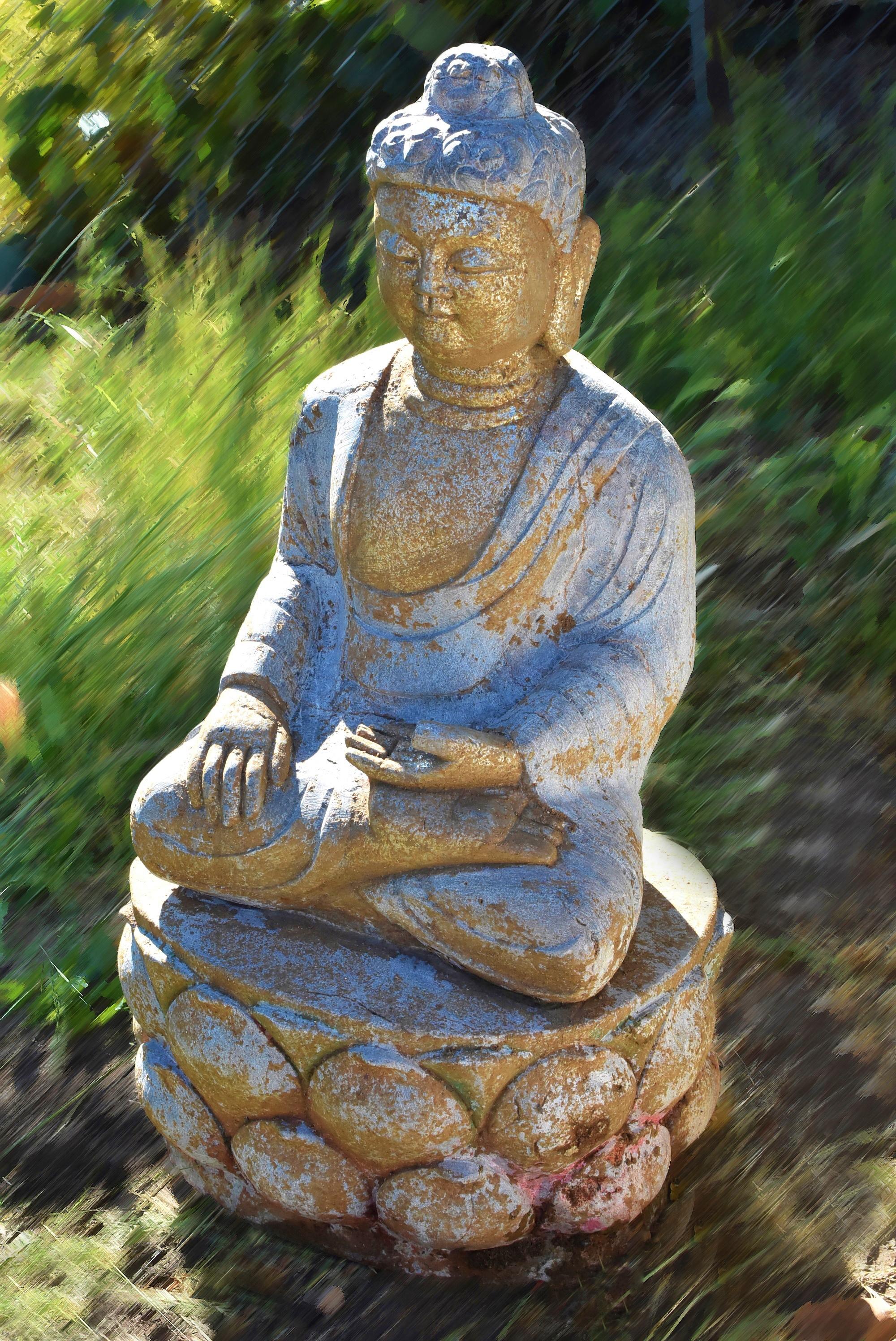 A beautiful hand carved statue of Buddha with golden face in the Tang style. Buddha is seated on a double lotus base, hands forming Bhumisparsha Mudra touching the earth symbolizing attaining enlightenment, dressed in a robe draping over shoulders