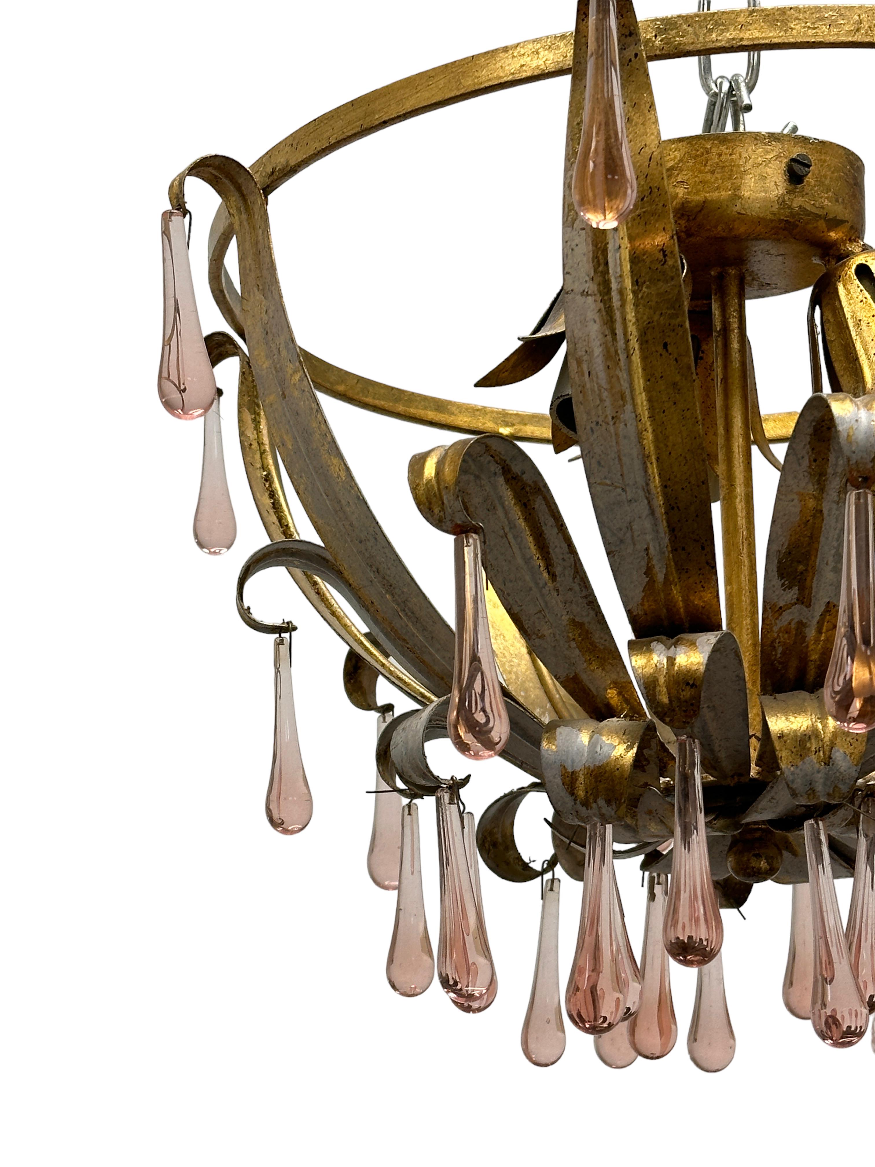 Add a touch of opulence to your home with this charming flush mount light. Perfect gilt metal leafs to enhance any chic or eclectic home. We'd love to see it hanging in an entryway as a charming welcome home. Built in the 1960s, made by Koegl