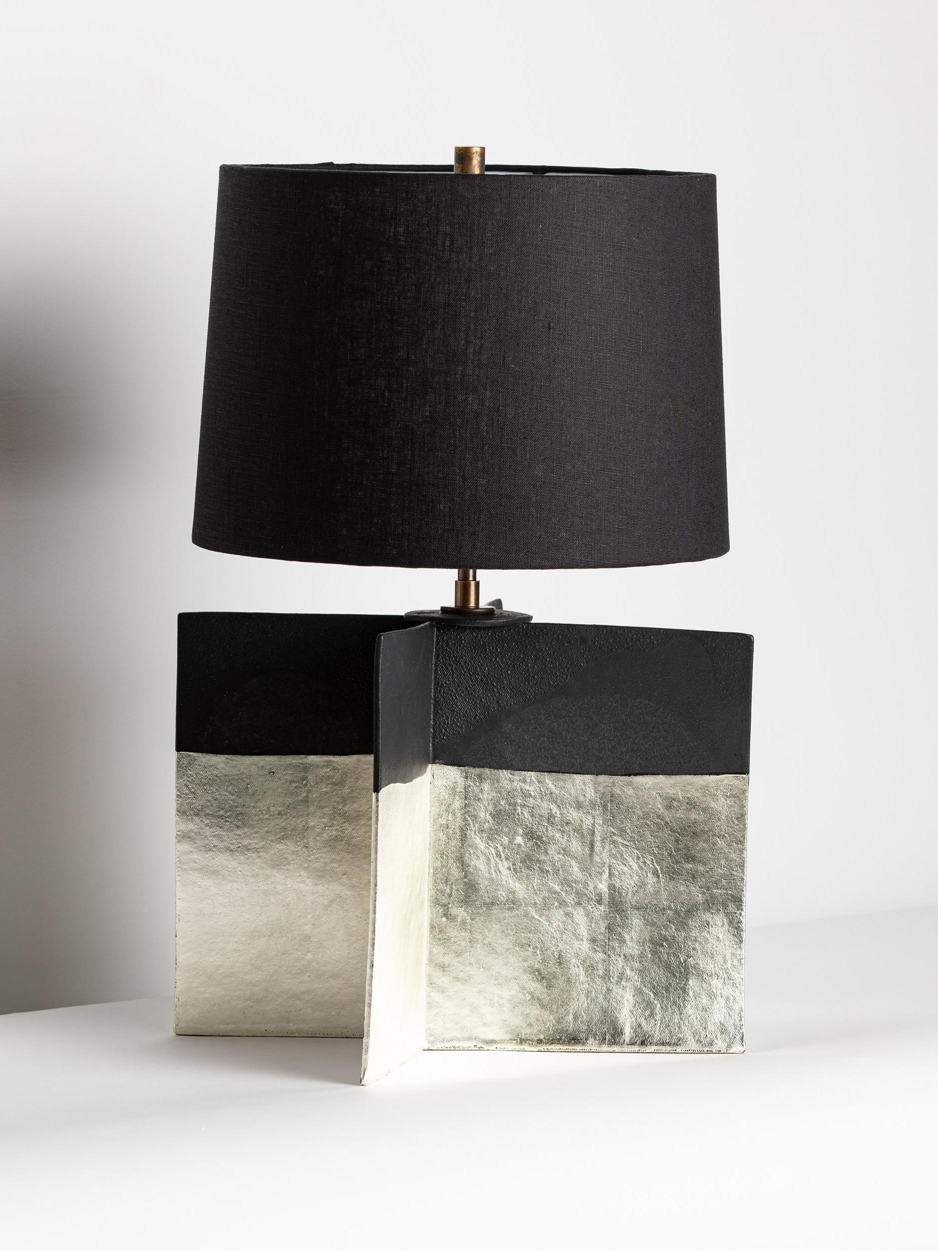 This limited edition Truro Lamp is the product of our collaboration with artist and master-gilder Carol Leskanic. Once glazed, 12K-white-gold leaf is applied to the handcrafted stoneware using a traditional oil gilding method.

FINISH

-