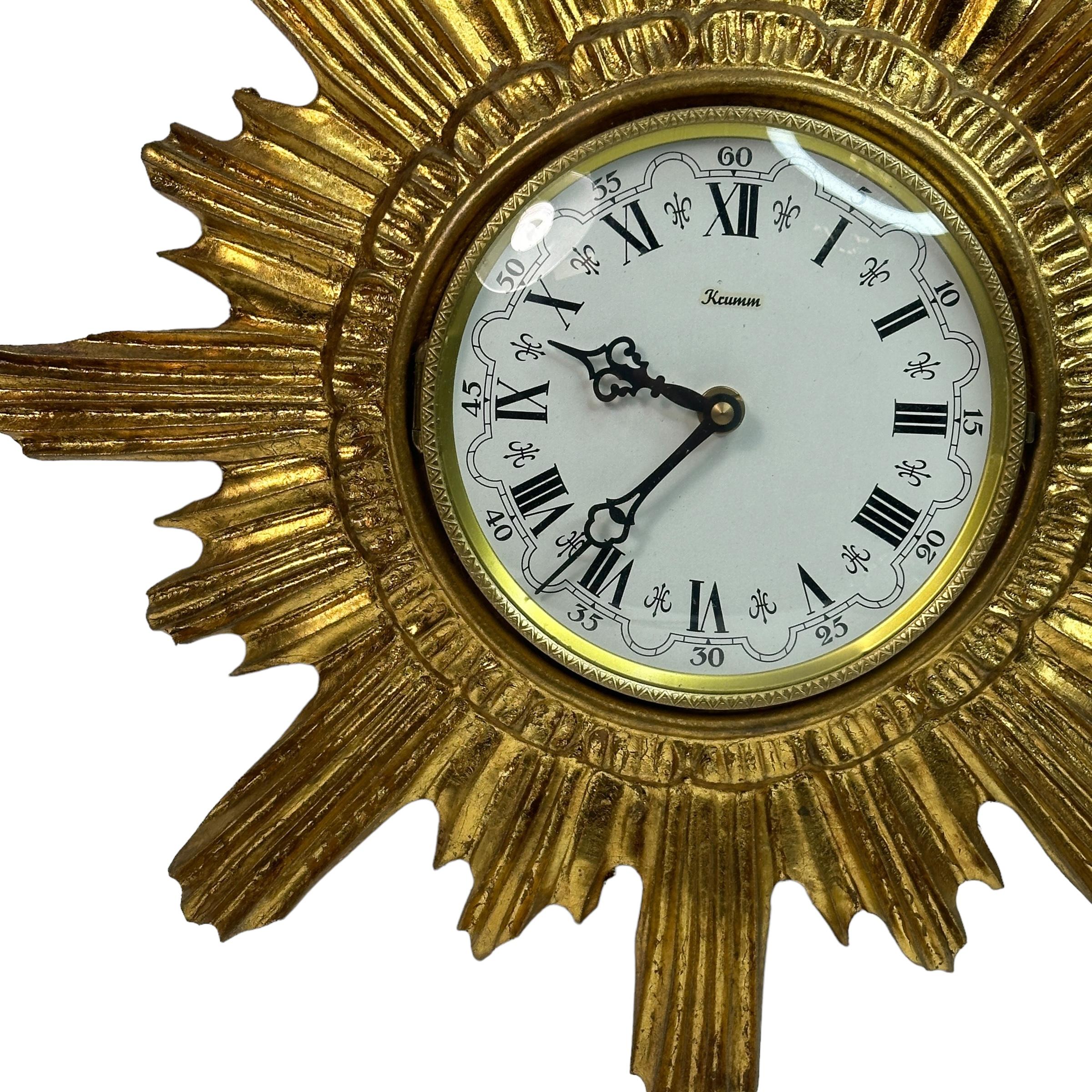 Stunning original 1960s sunburst starburst wall clock. Featuring beautiful wood and composition sunburst surrounding illustrating perfectly the mood of the decade. It is in very good original condition and it is battery operated adjustable movement