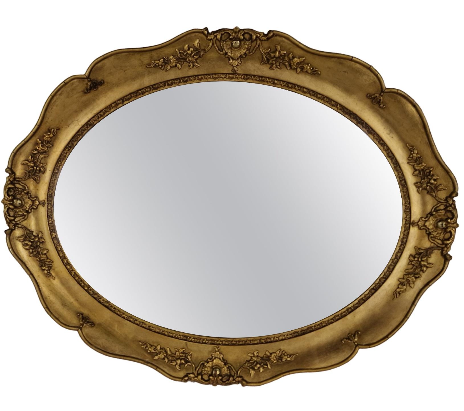 Wonderful rare oval wall mirror / frame, in well known classic shape, of the Biedermeier period, made around 1860 in Austria, Europe. 
The special stucco work all around the frame in a floral design make this object an extraordinary piece.
This