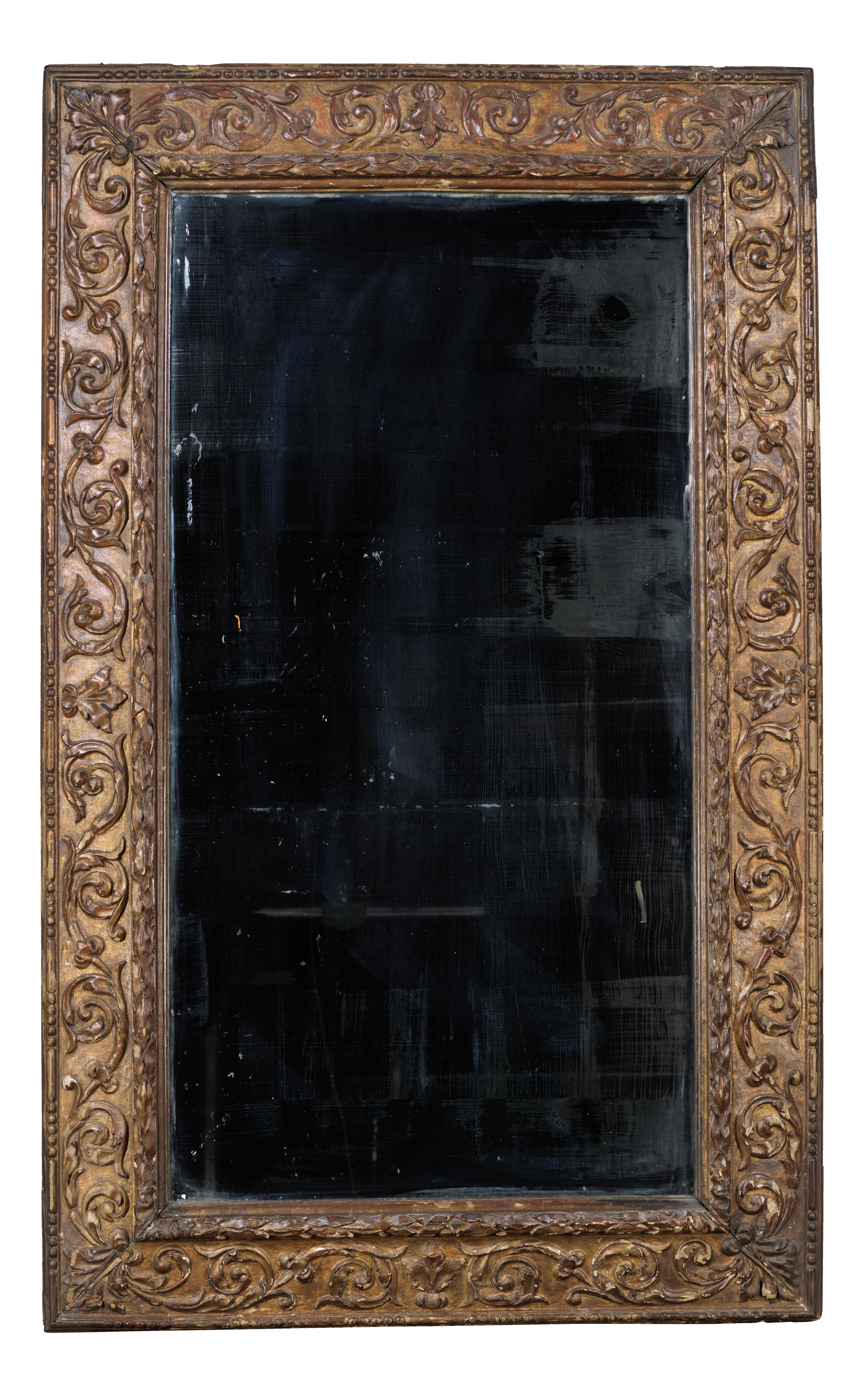 Large Italian mirror with a carved gilded wood frame. A roundel is covered by laurel leaves and folliage-scrolls on a smooth background. 
The outer edge is hemmed by alternating beads and billets moulding.
