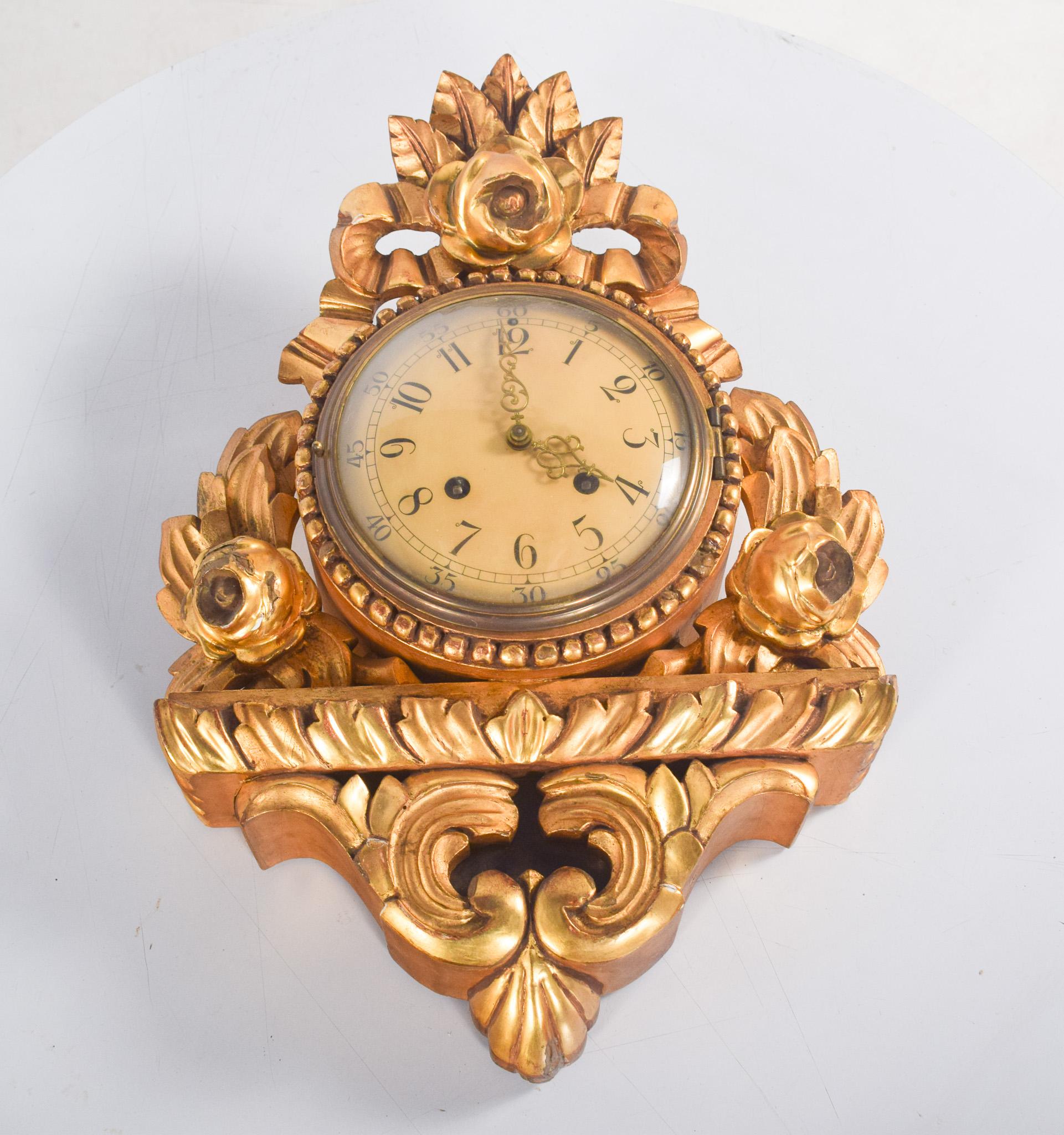 Gilded wood wall clock with Andreas Svensson dial, Malmo. Impressive handiwork from the early 20th century, with a classic and sophisticated design. The richly decorated structure is made of gilded wood with carvings that recall the Baroque style.