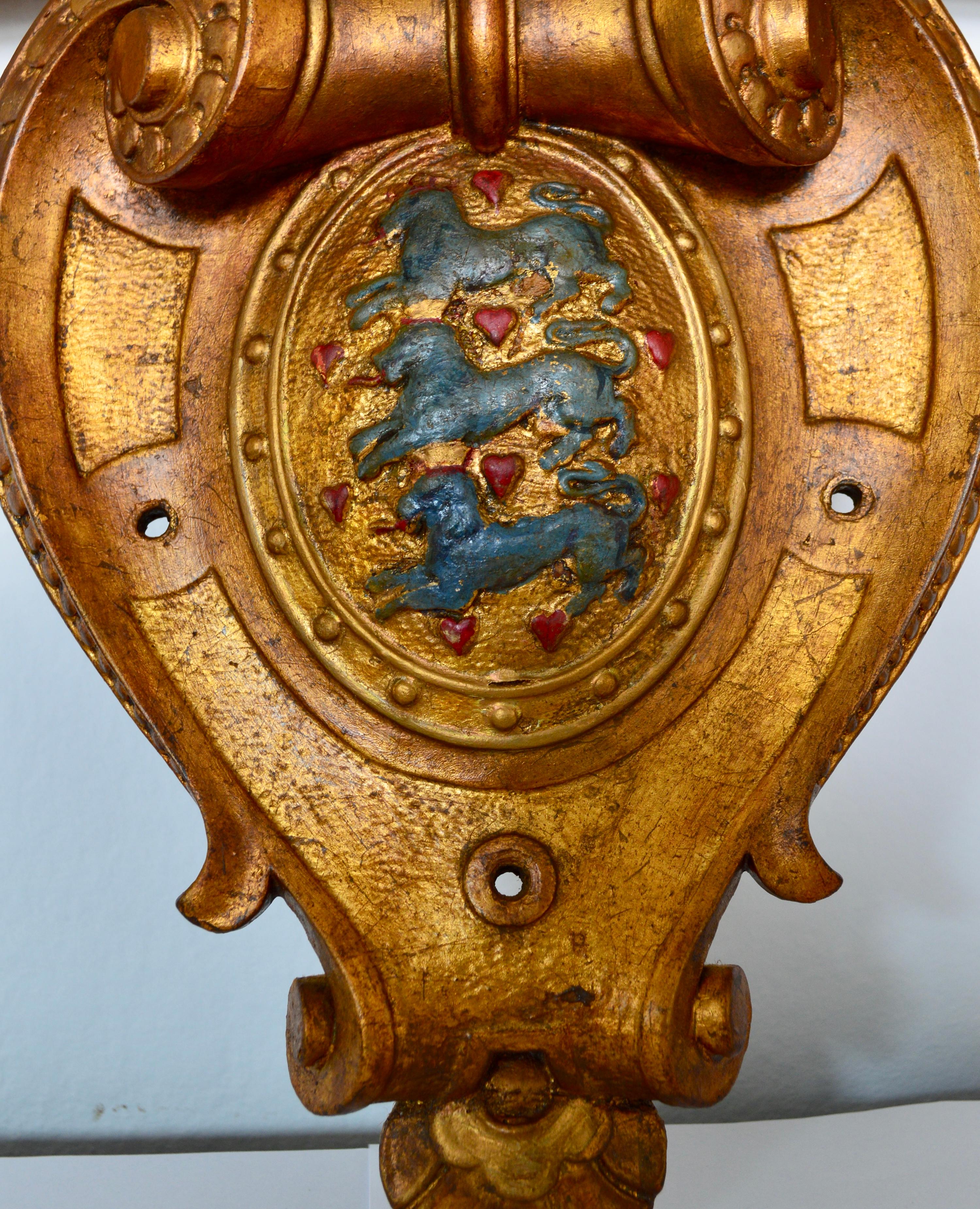 Gilded wooden plaque with the carved coat of arms of Denmark.