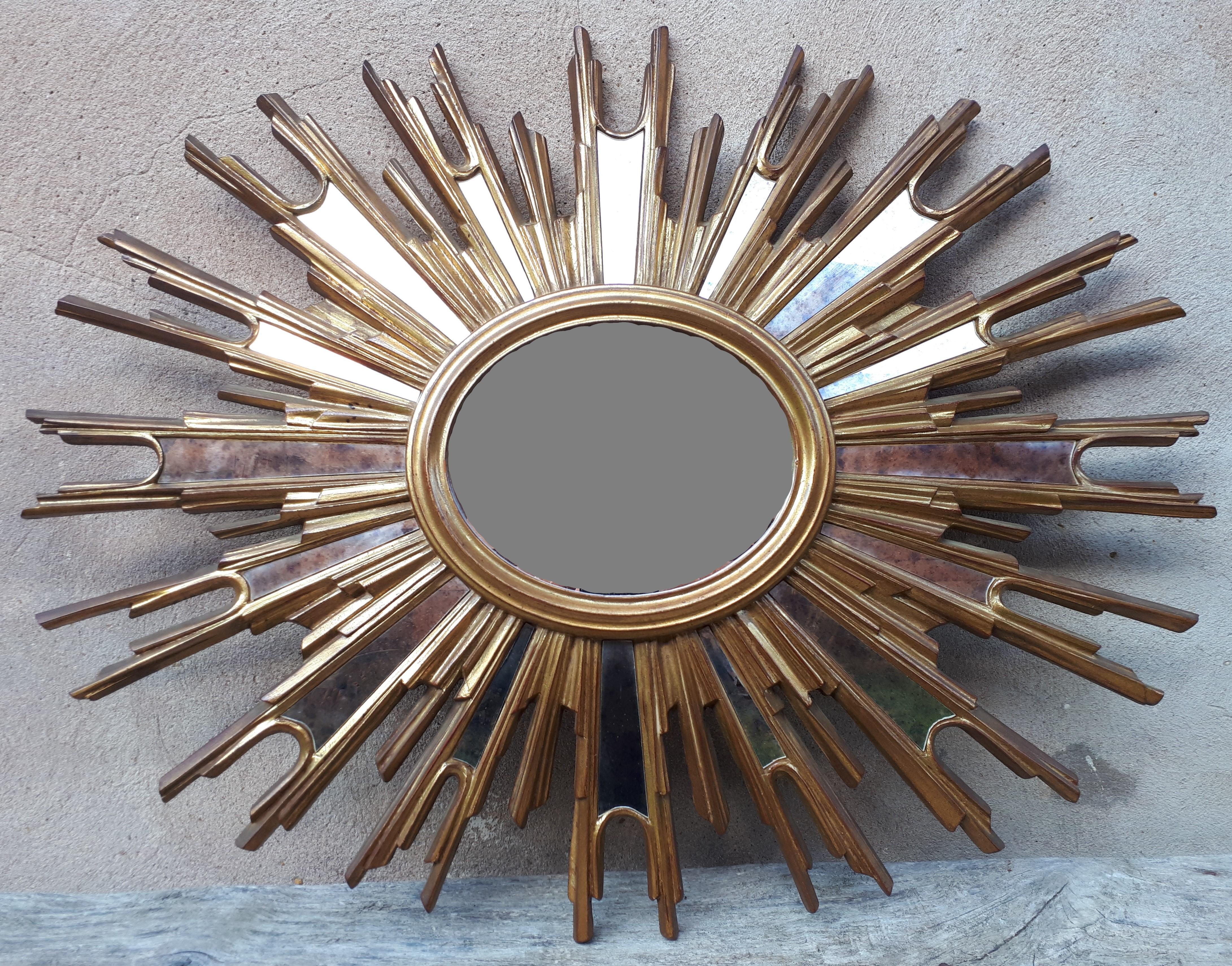 Gilt Gilded wooden witch or sunburst mirror, France 1950 For Sale